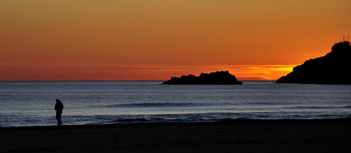 Jogging on the beach with sunset in the eyes...