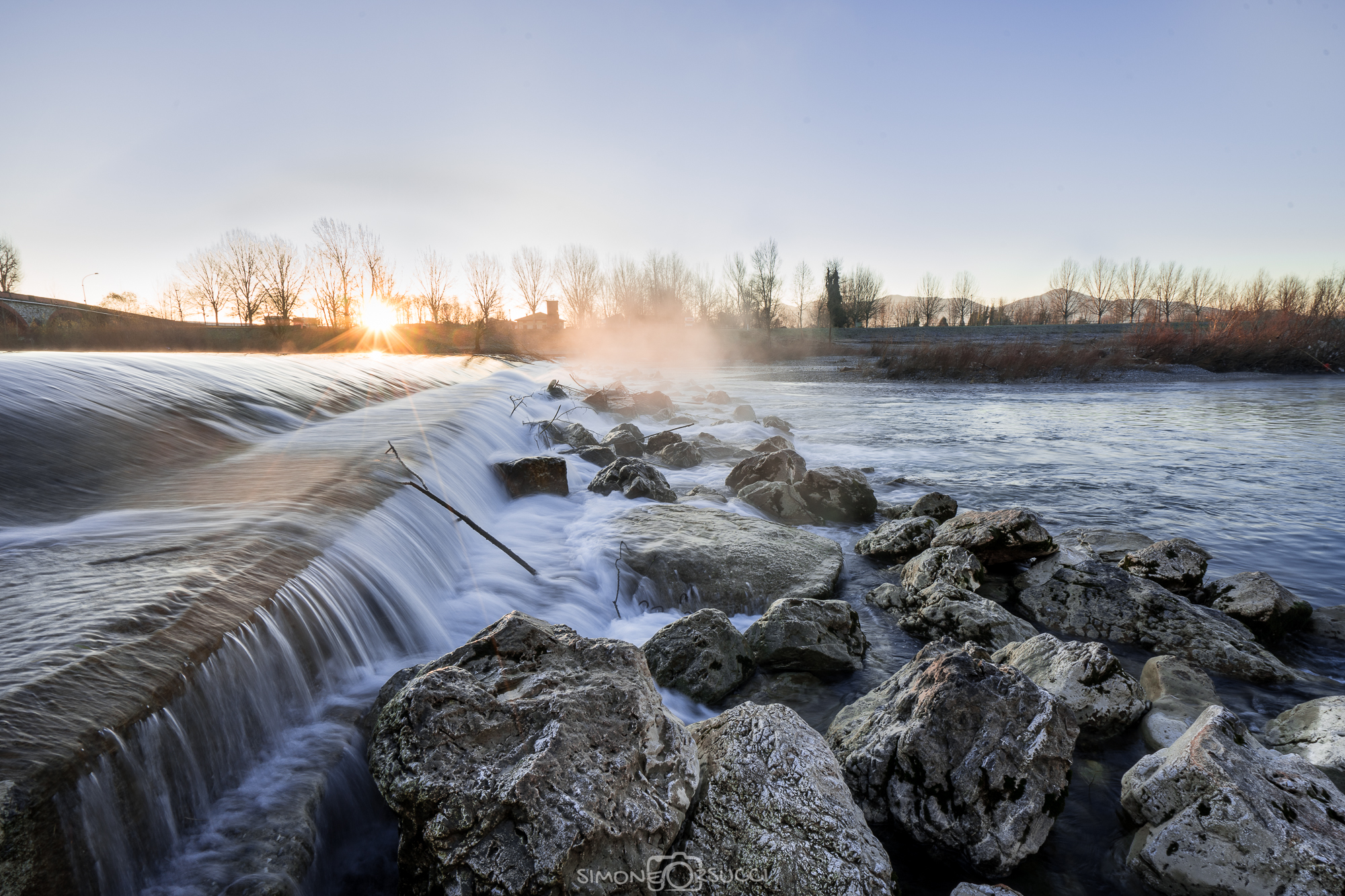 The sun rises over the Serchio River Park