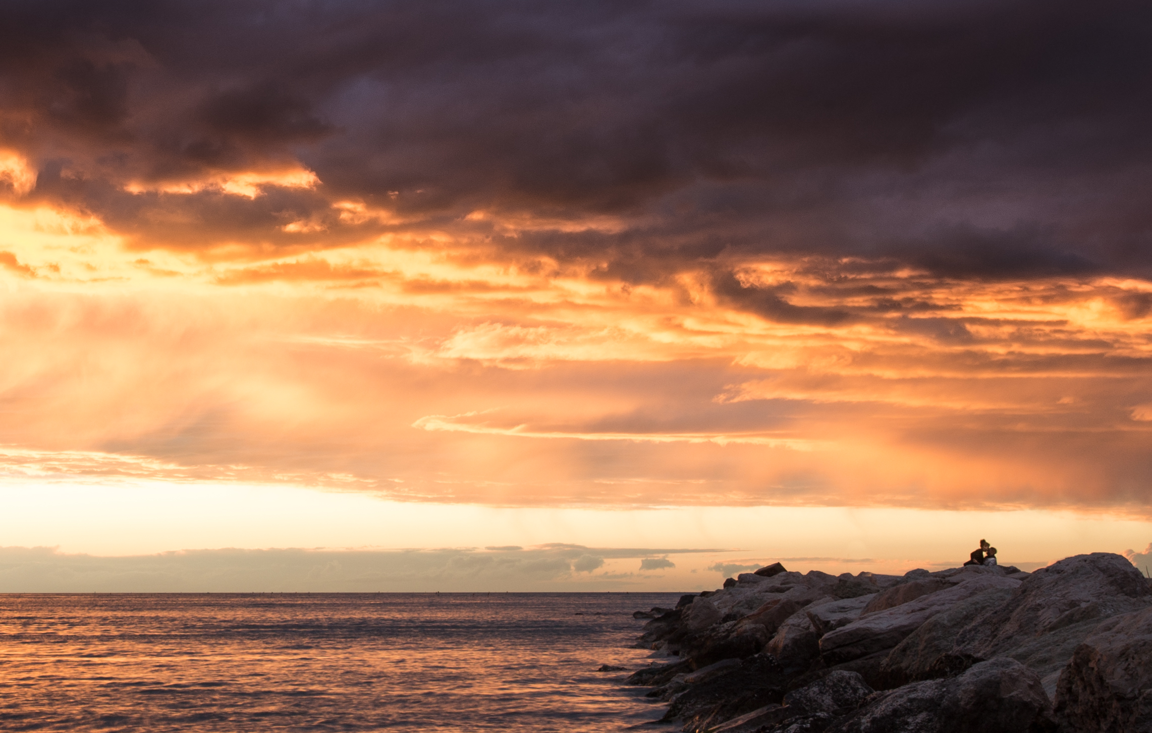 Young couple of other times - sunset in the storm