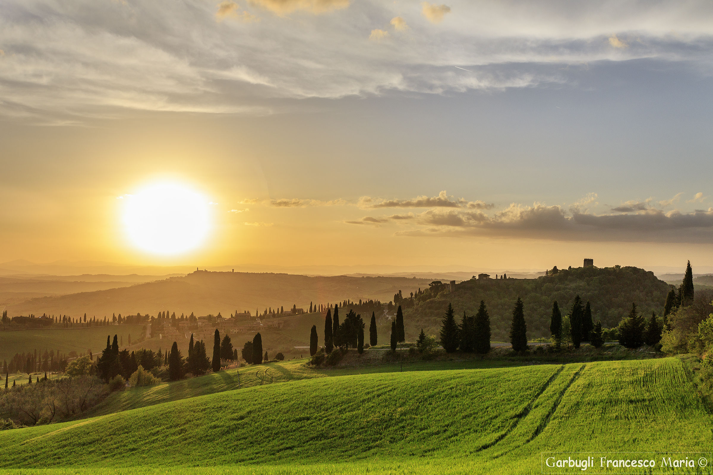 Pienza on the horizon at full sunset