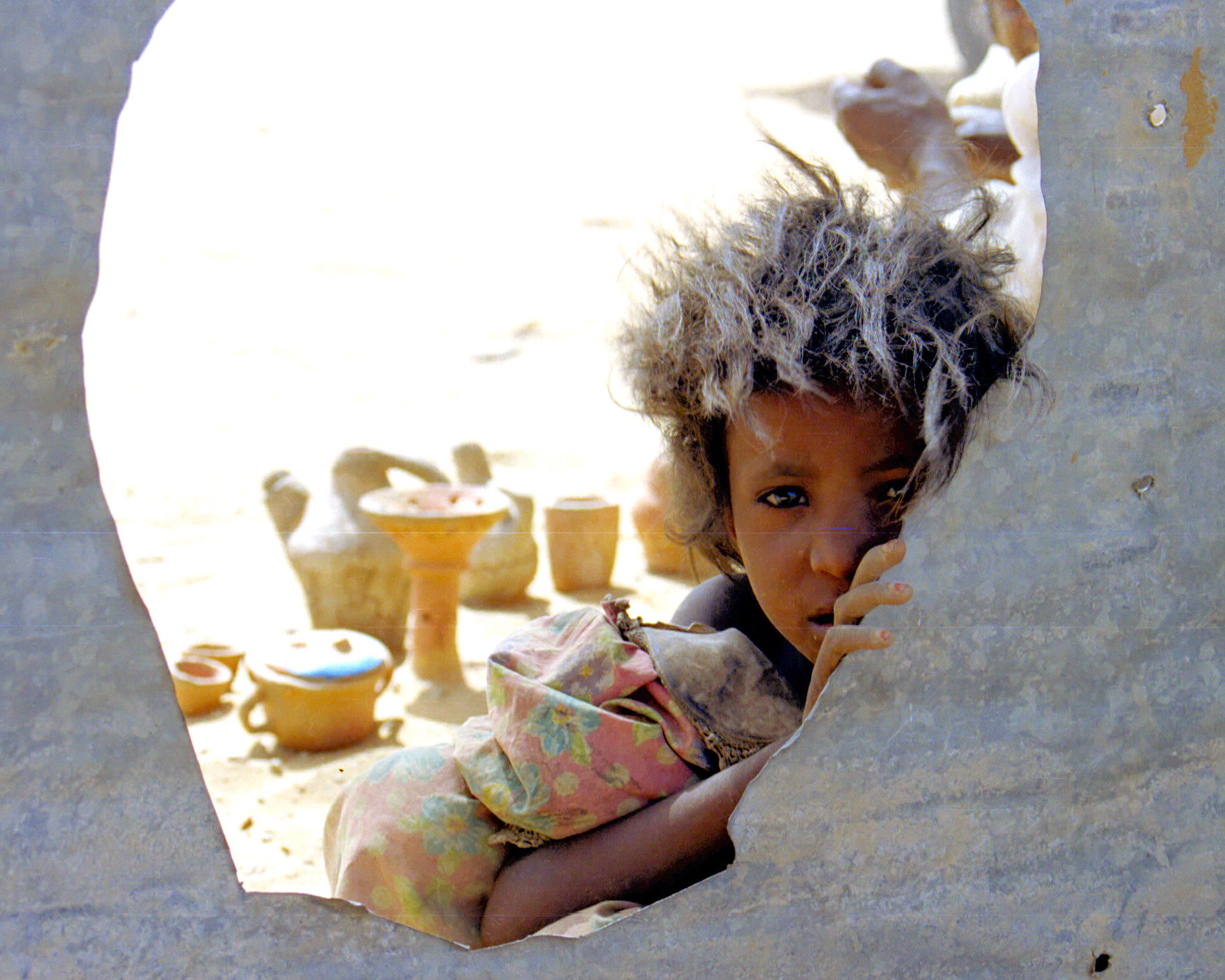 Sudan:sfumature di sabbia tra i capelli