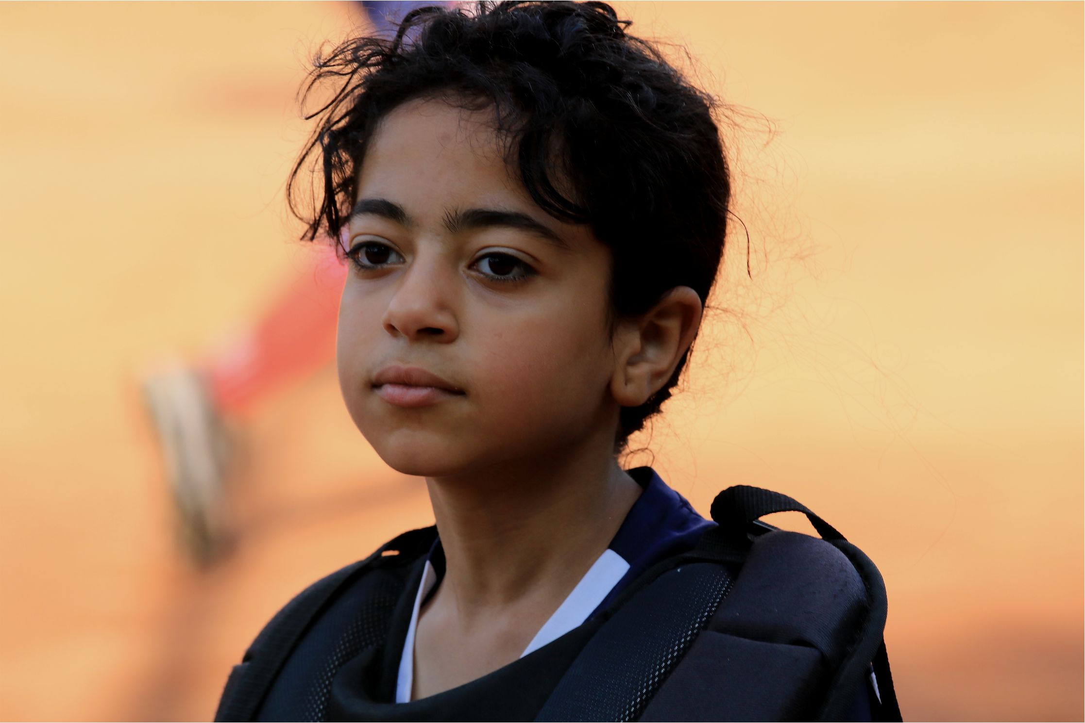 Among the tiny softballs.