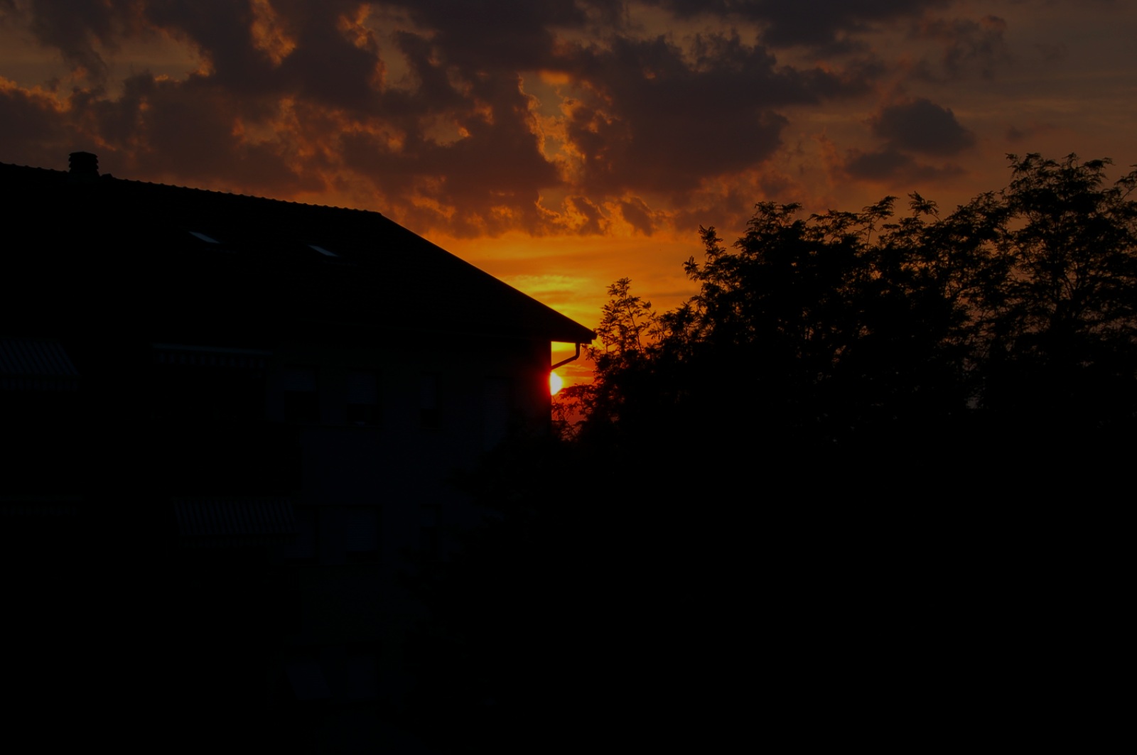 Sunset from behind a home