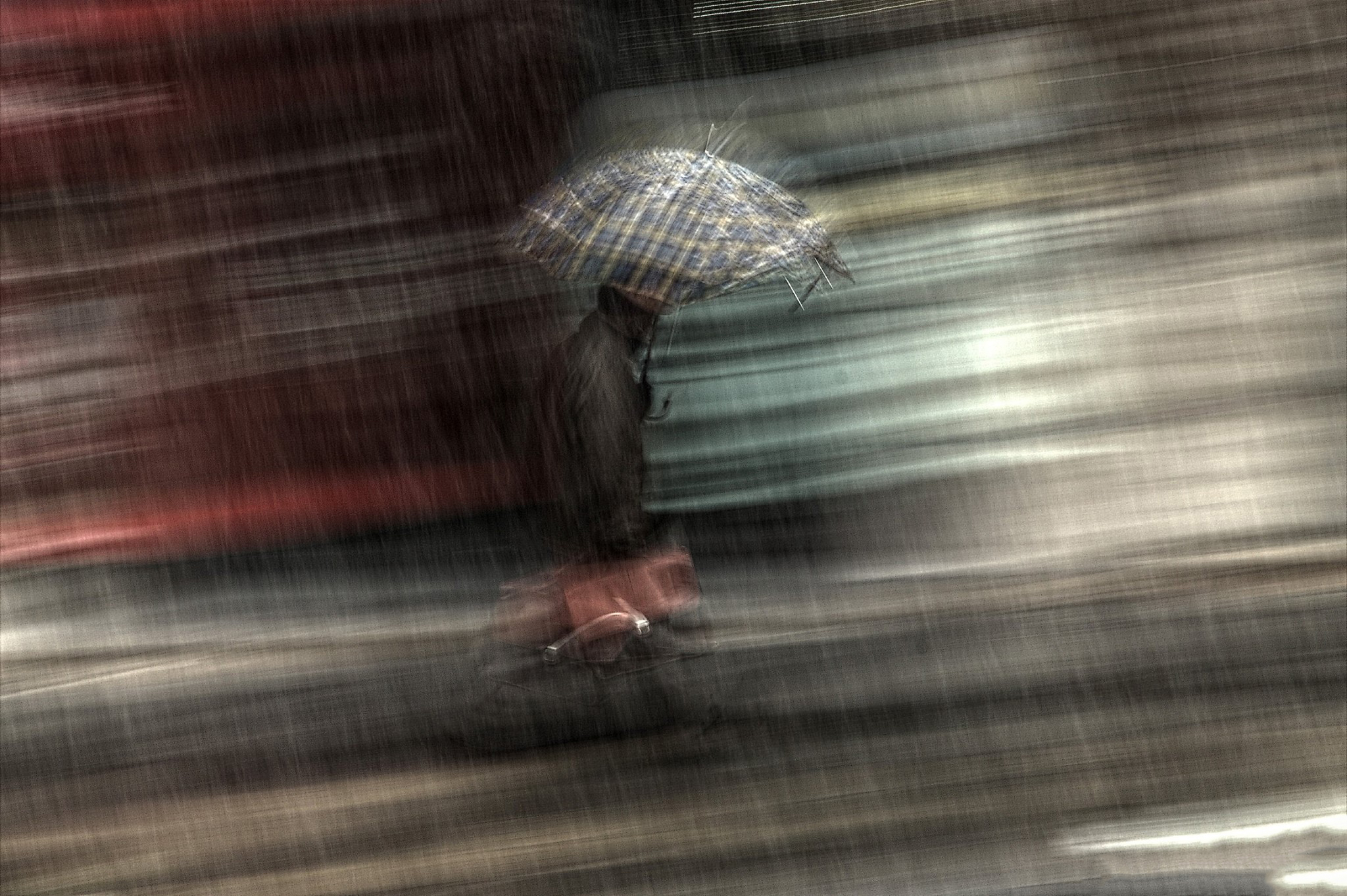 Man with bag and umbrella