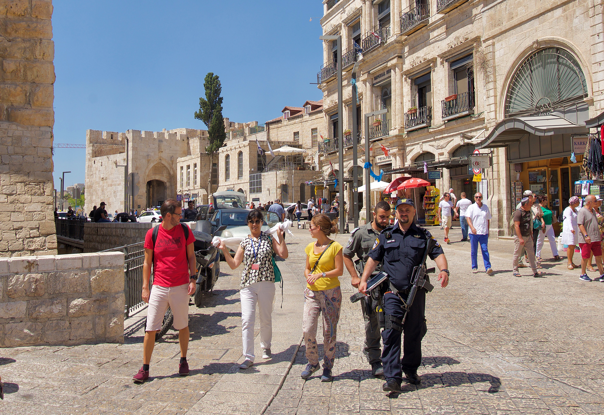 Armed policemen and tourists