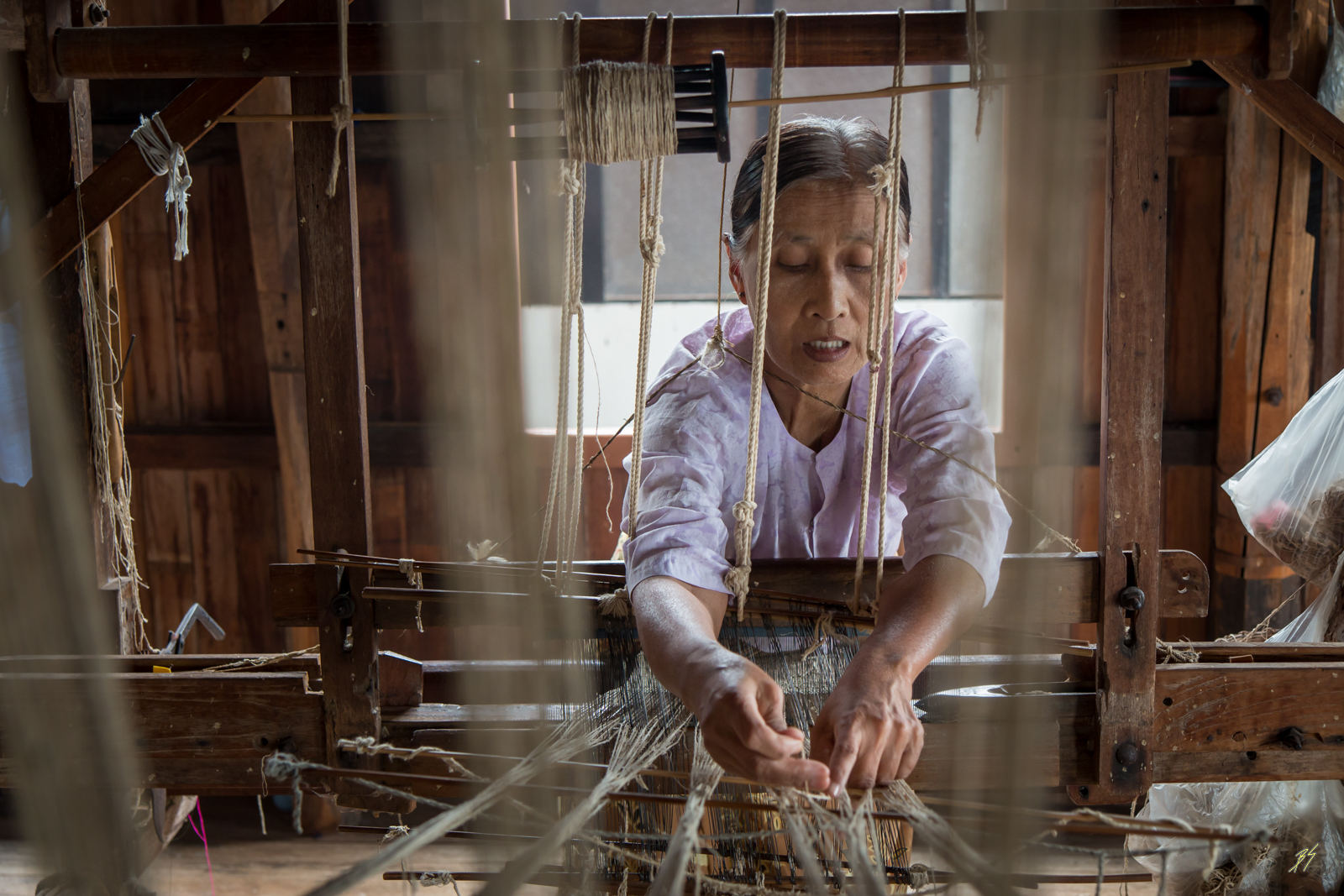 Burma, woman works on a chassis