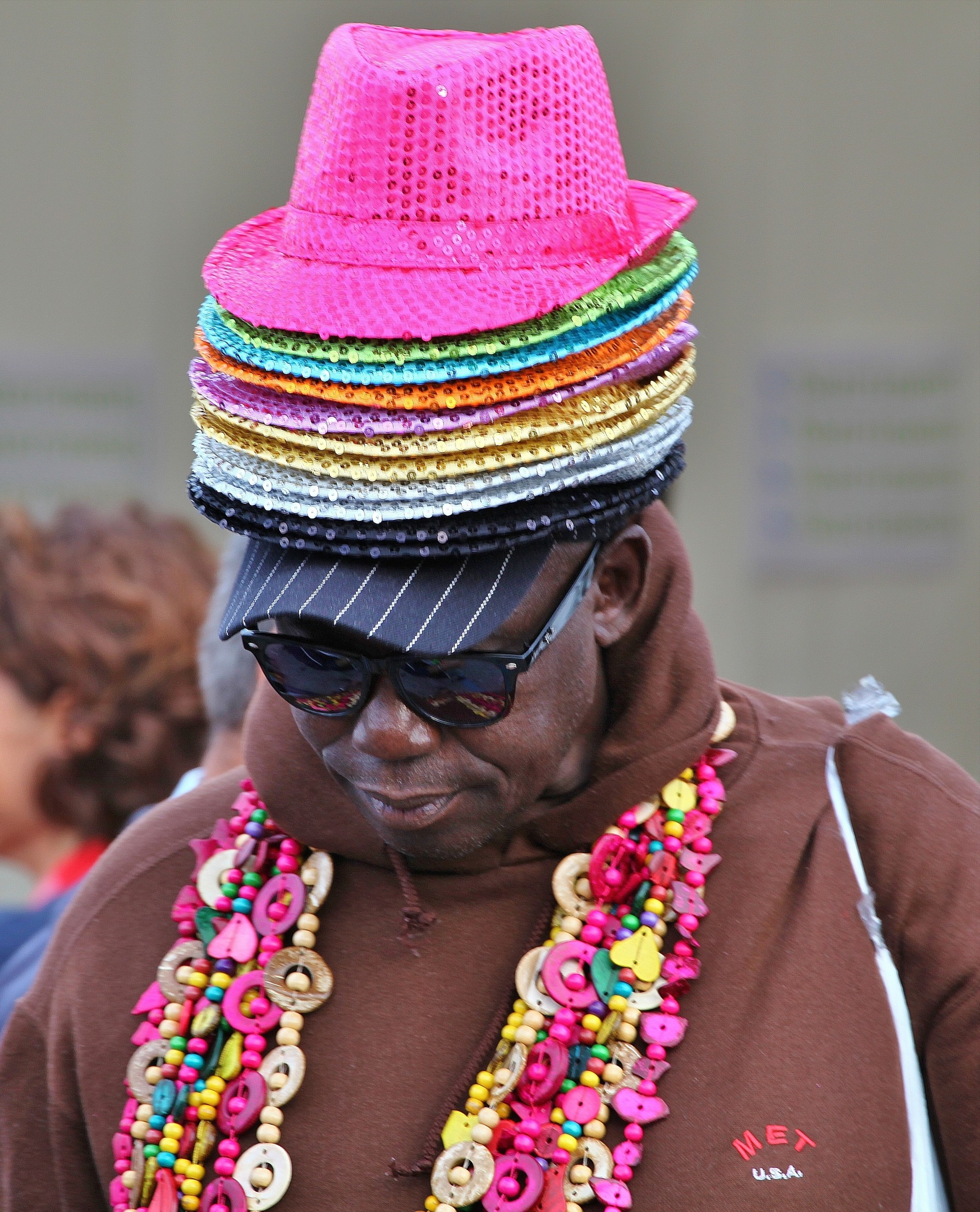 Seller of hats and necklaces.