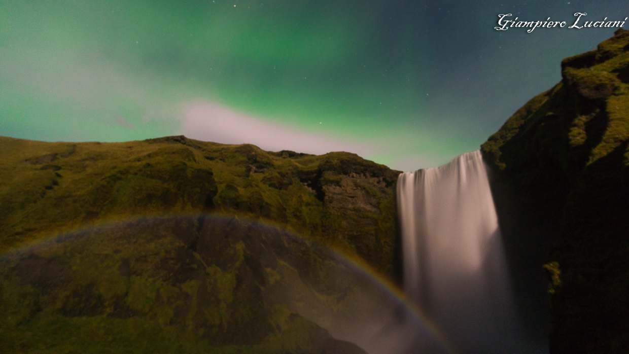 northern light moonbow at skogafoss