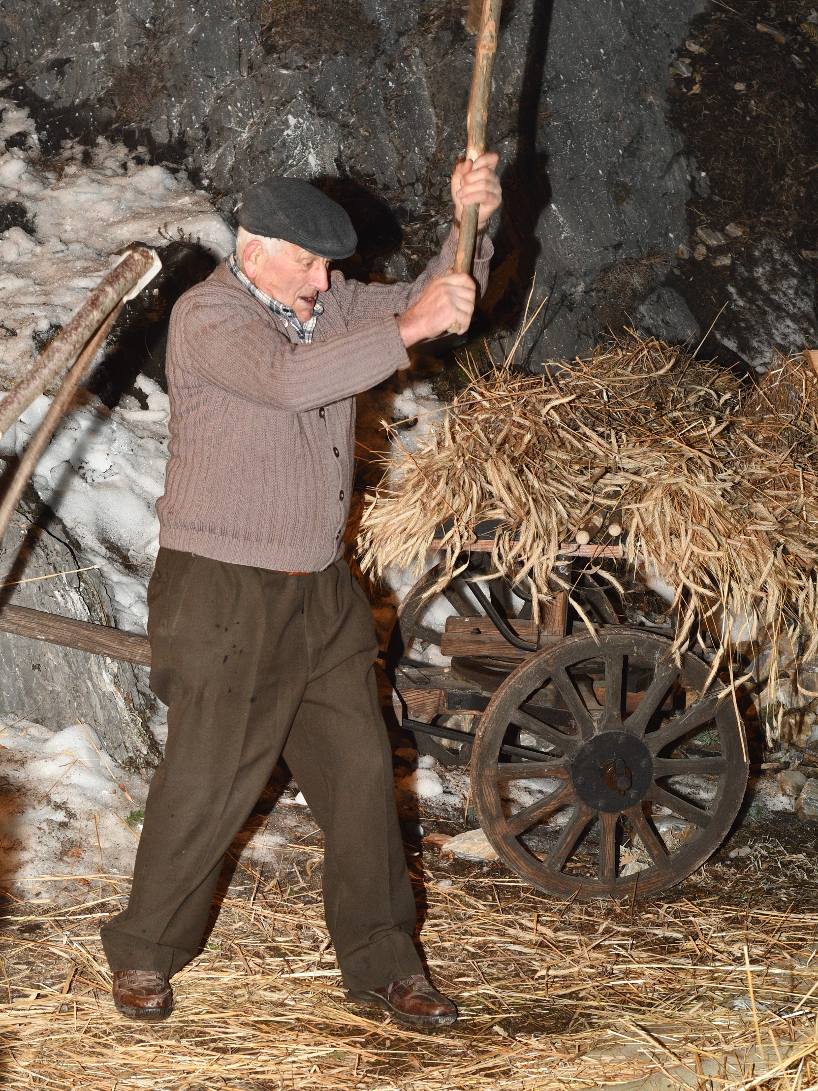 Baptist while beating the grain