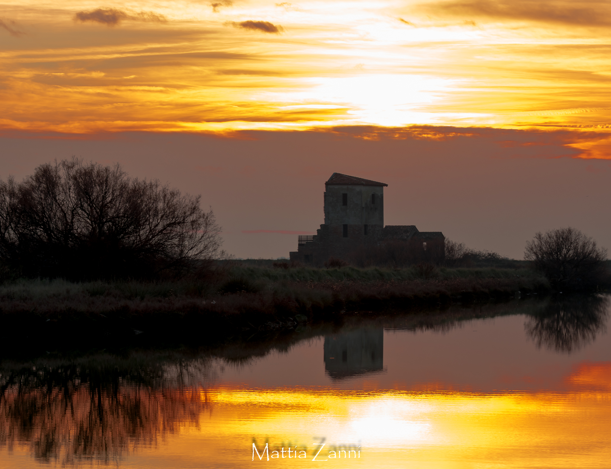 Red tower at the entrance to the saltworks in Comacchio