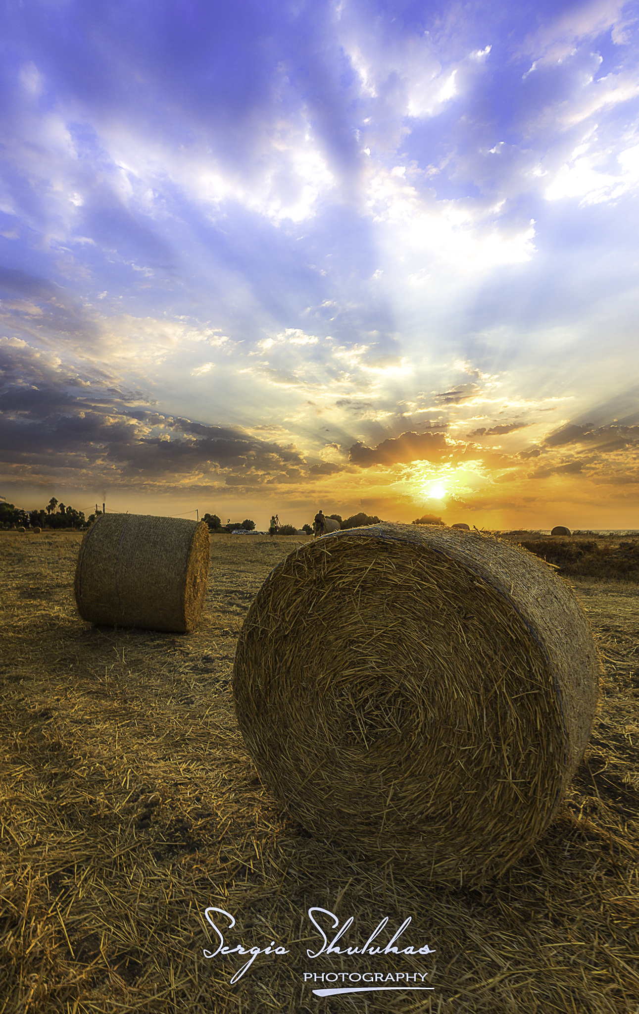 Sunset over haybales