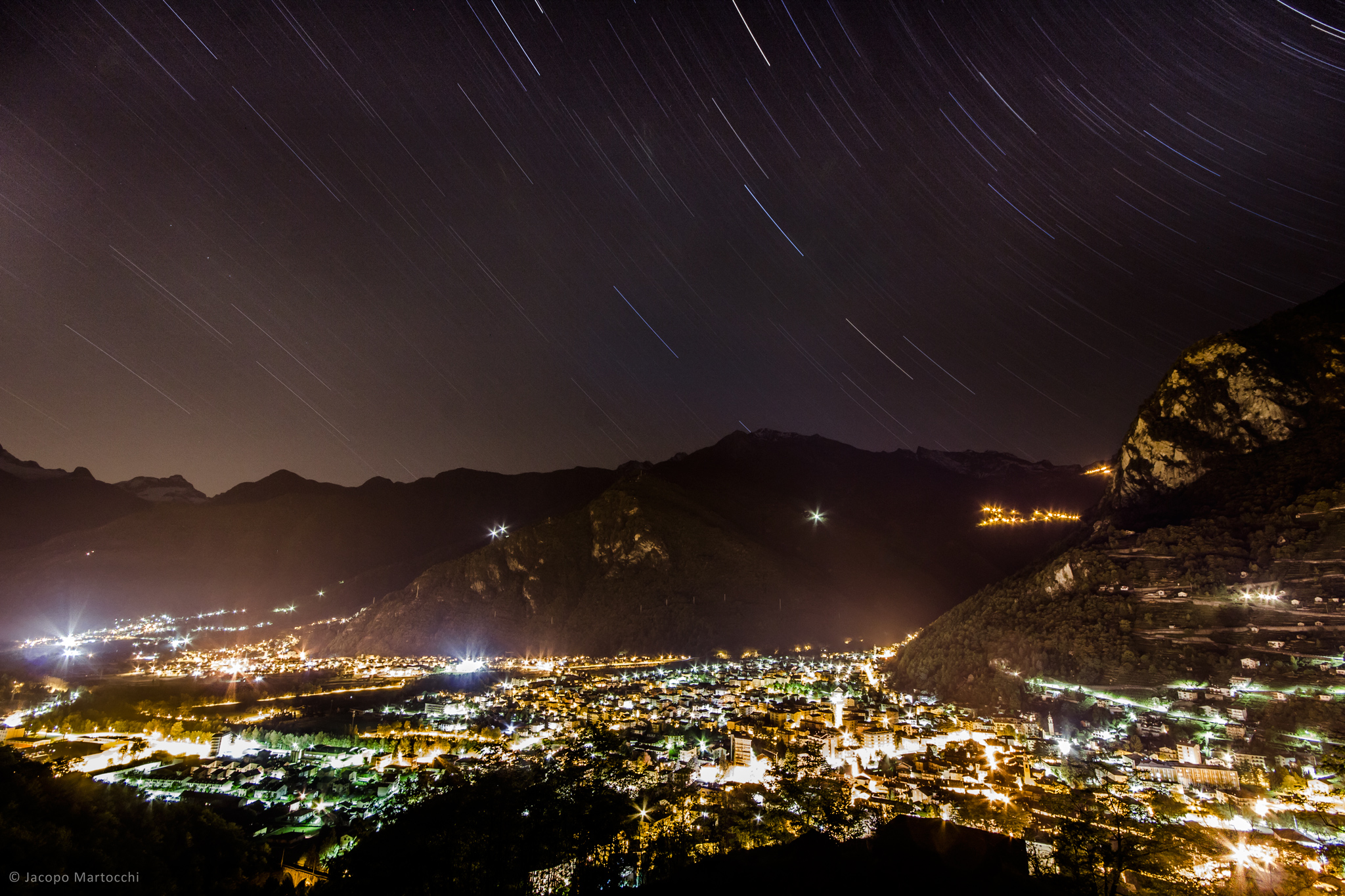 A river of lights under a rain of stars