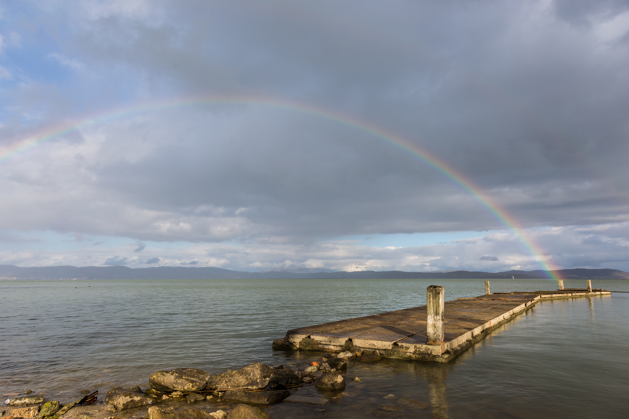 Pier and rainbow