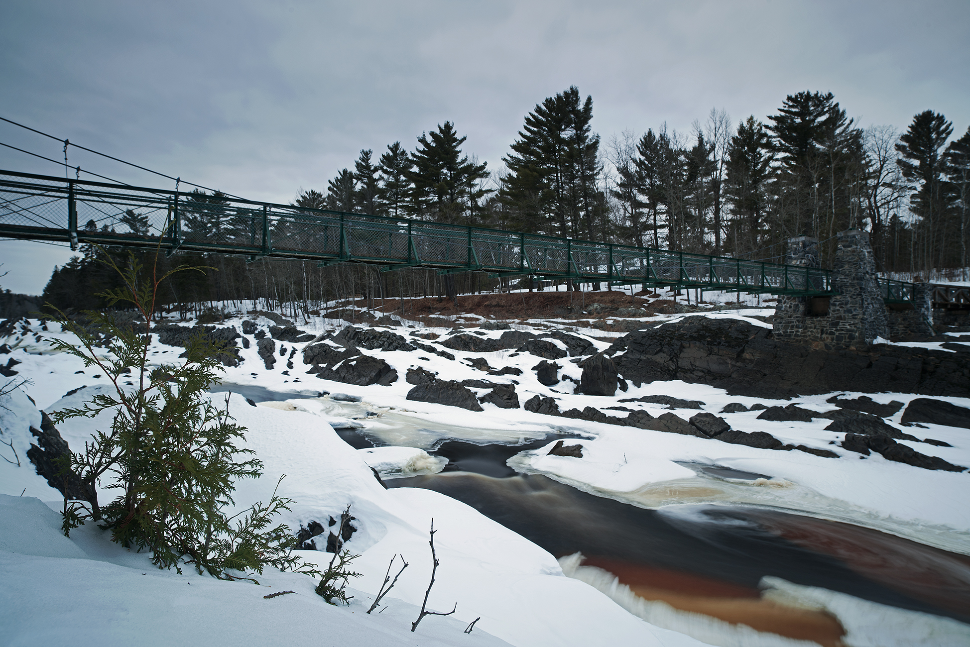 Swinging Bridge In Winter