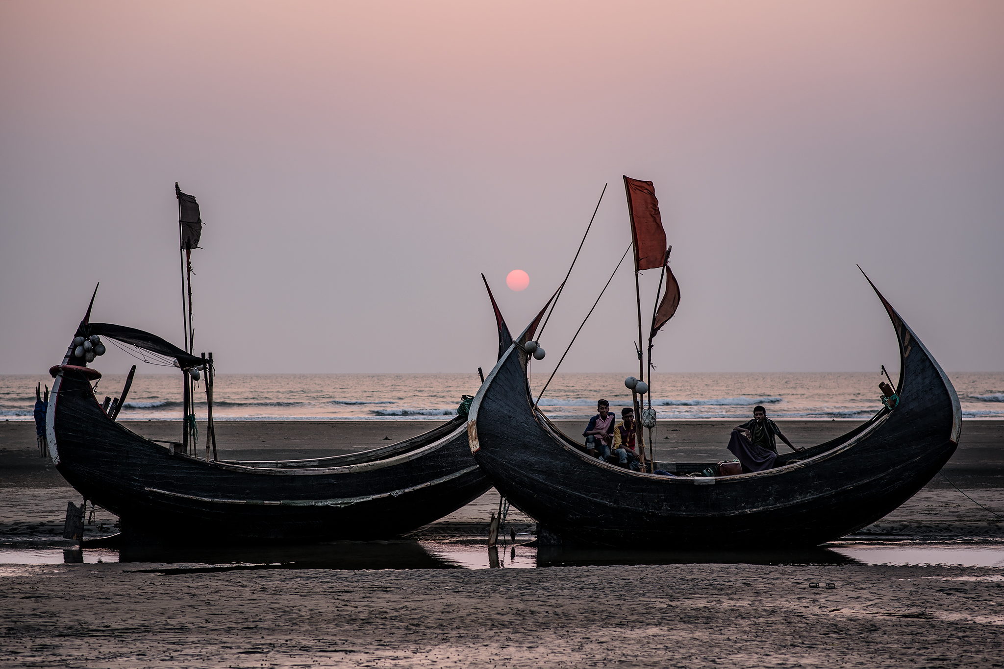 Fishing boats at sunset