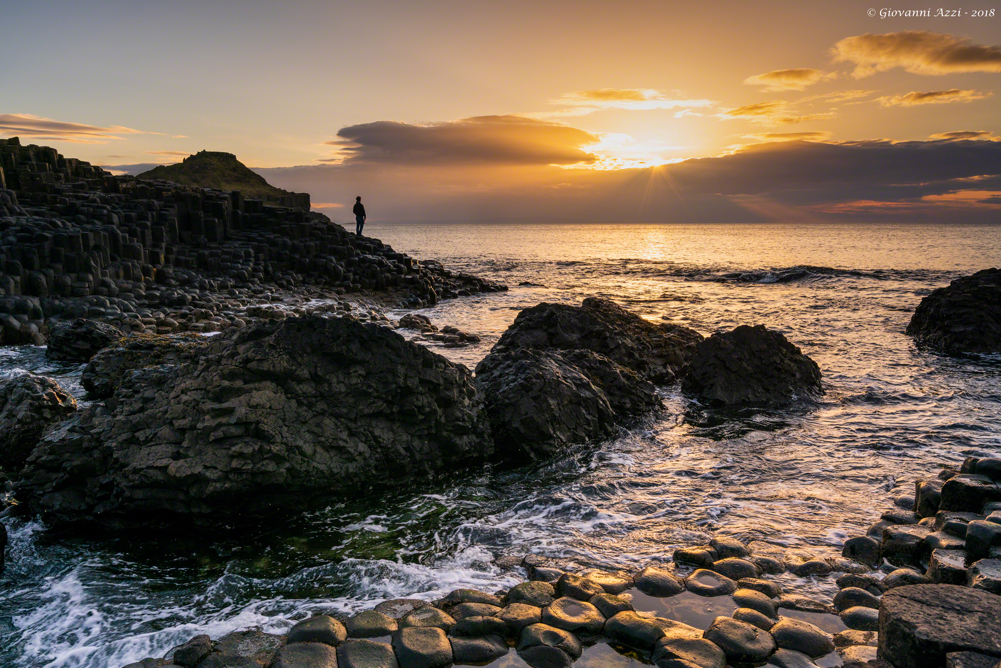 Admiring the sunset ate the Giant's Causeway