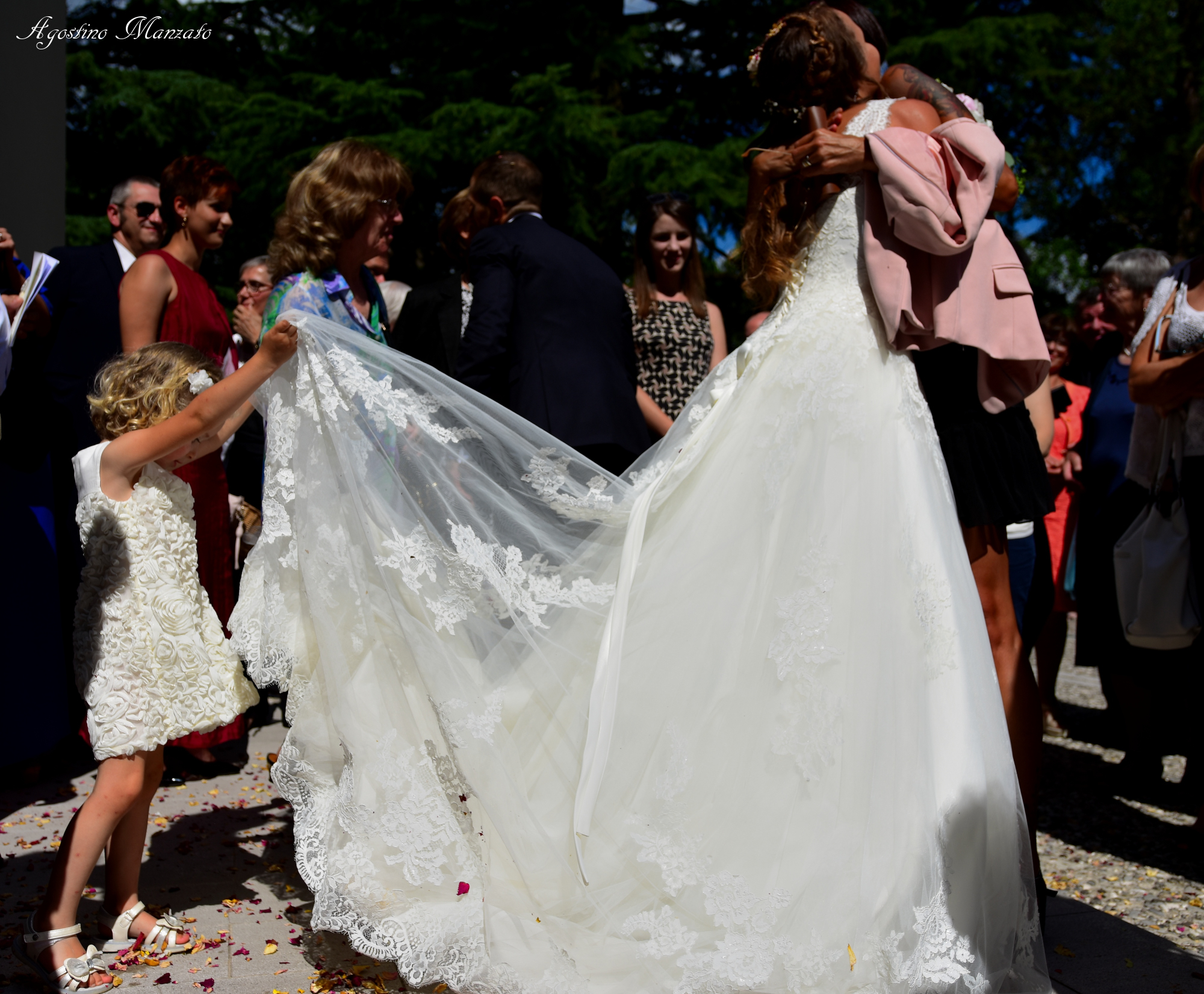 Bridesmaid cleans bride from rose petals