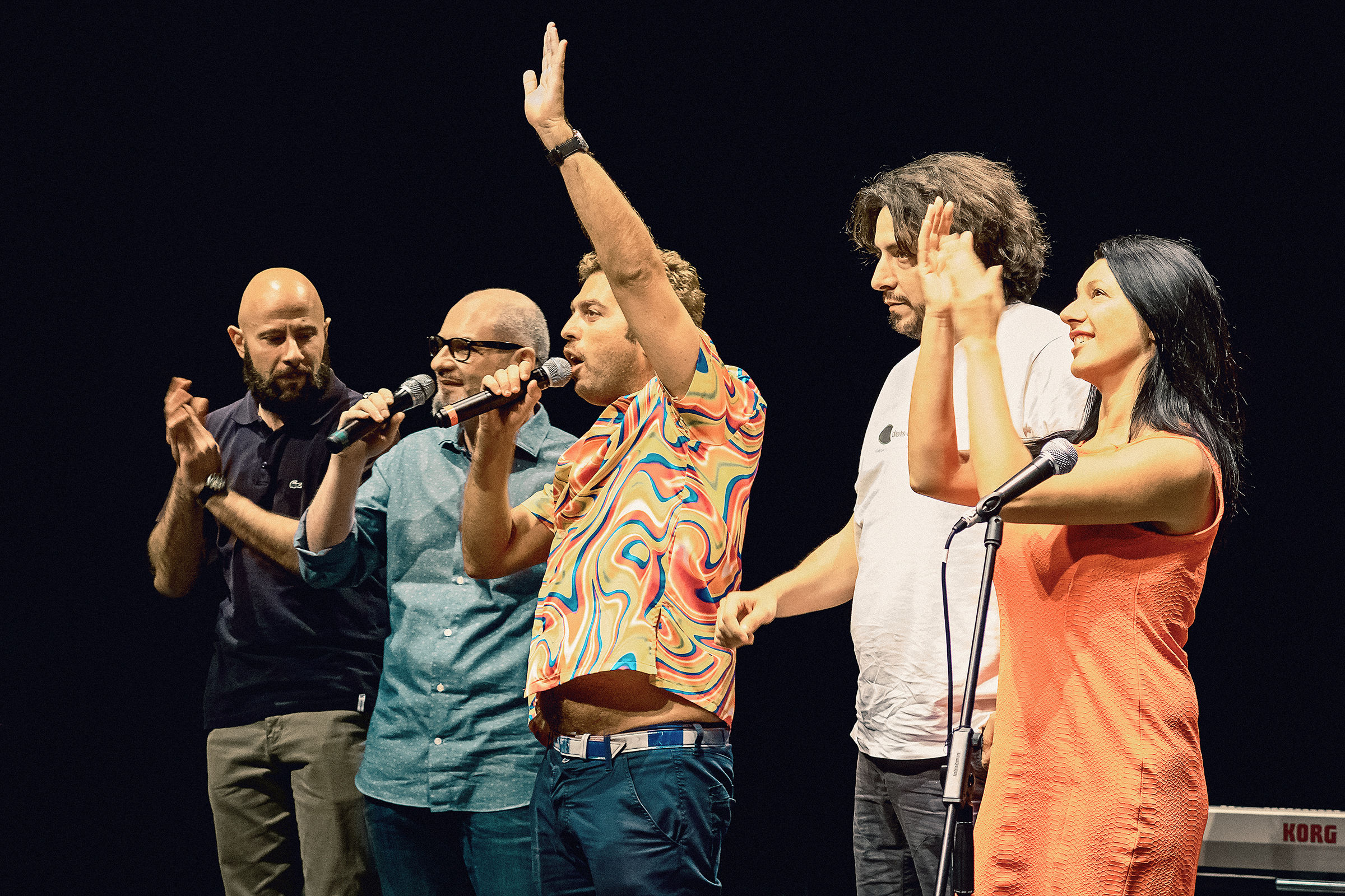 The crew salutes the audience at the end of the concert
