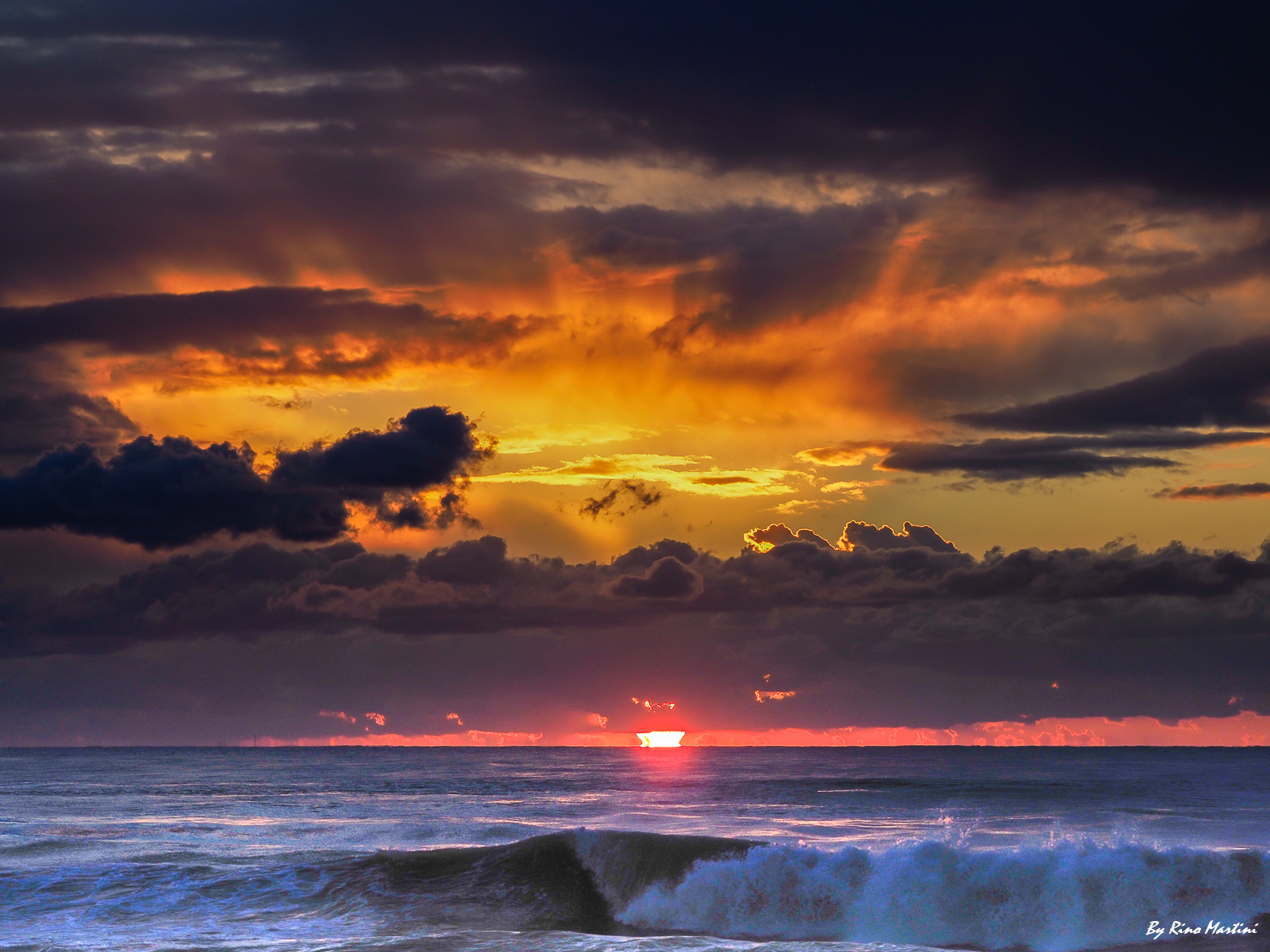 Waves Sun and clouds