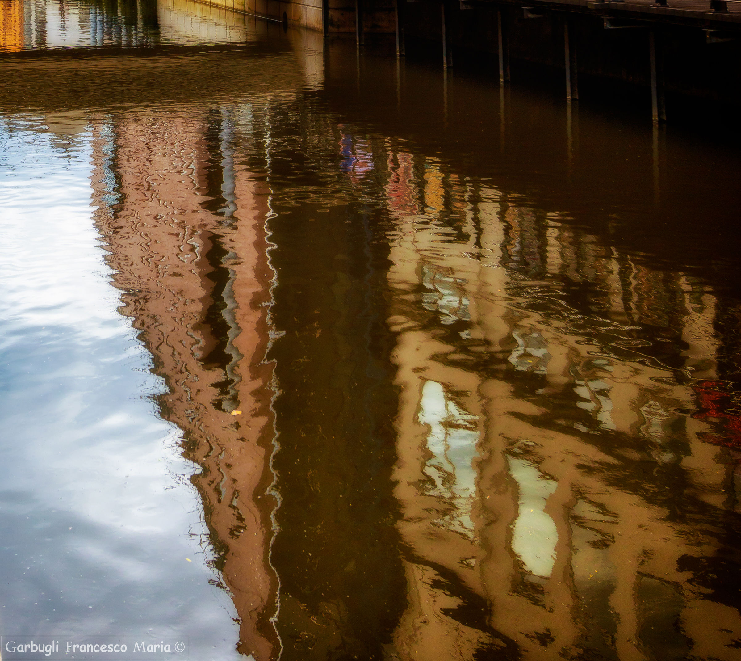 reflected in the canal