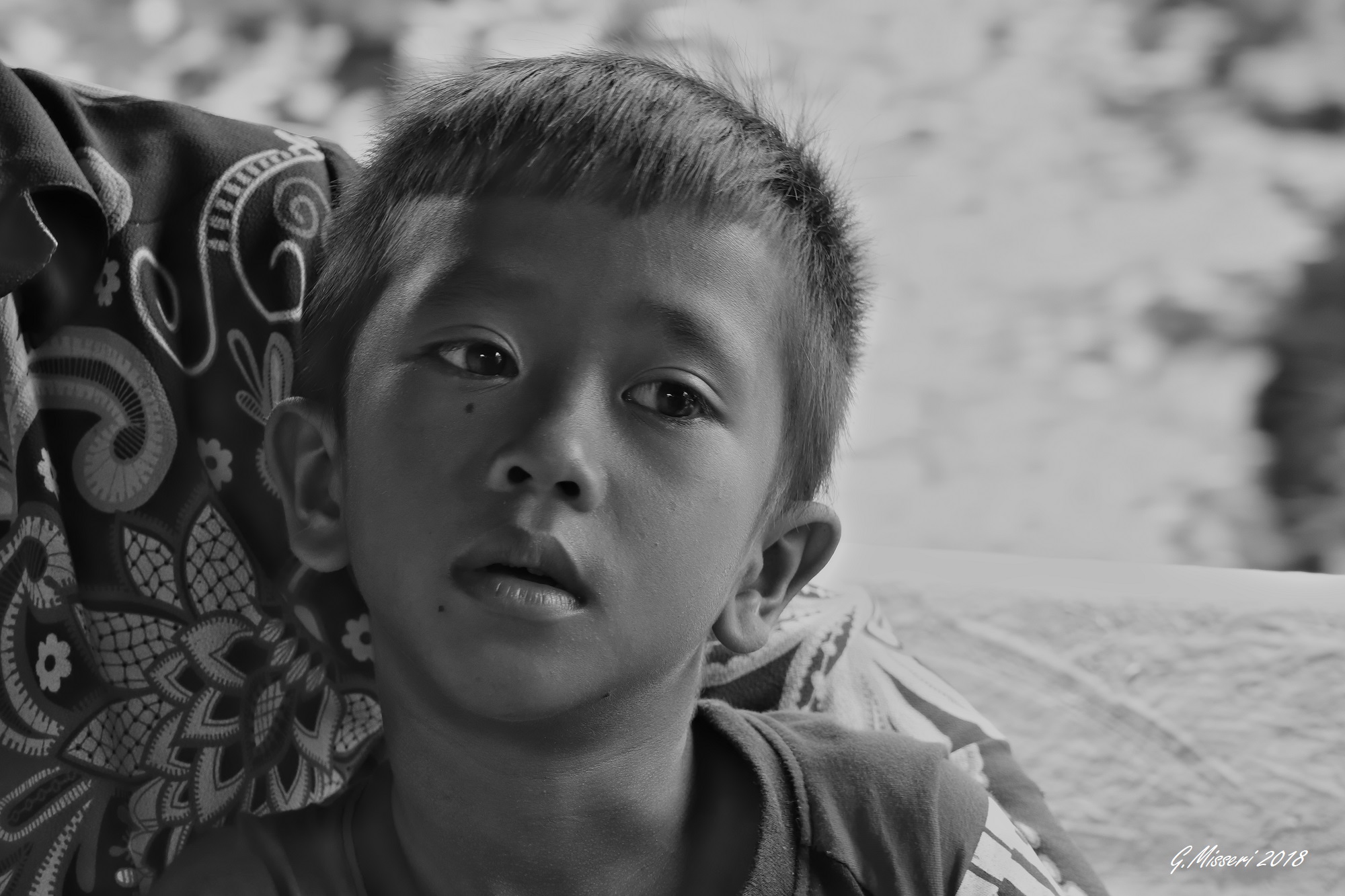 A small child, traveling companion