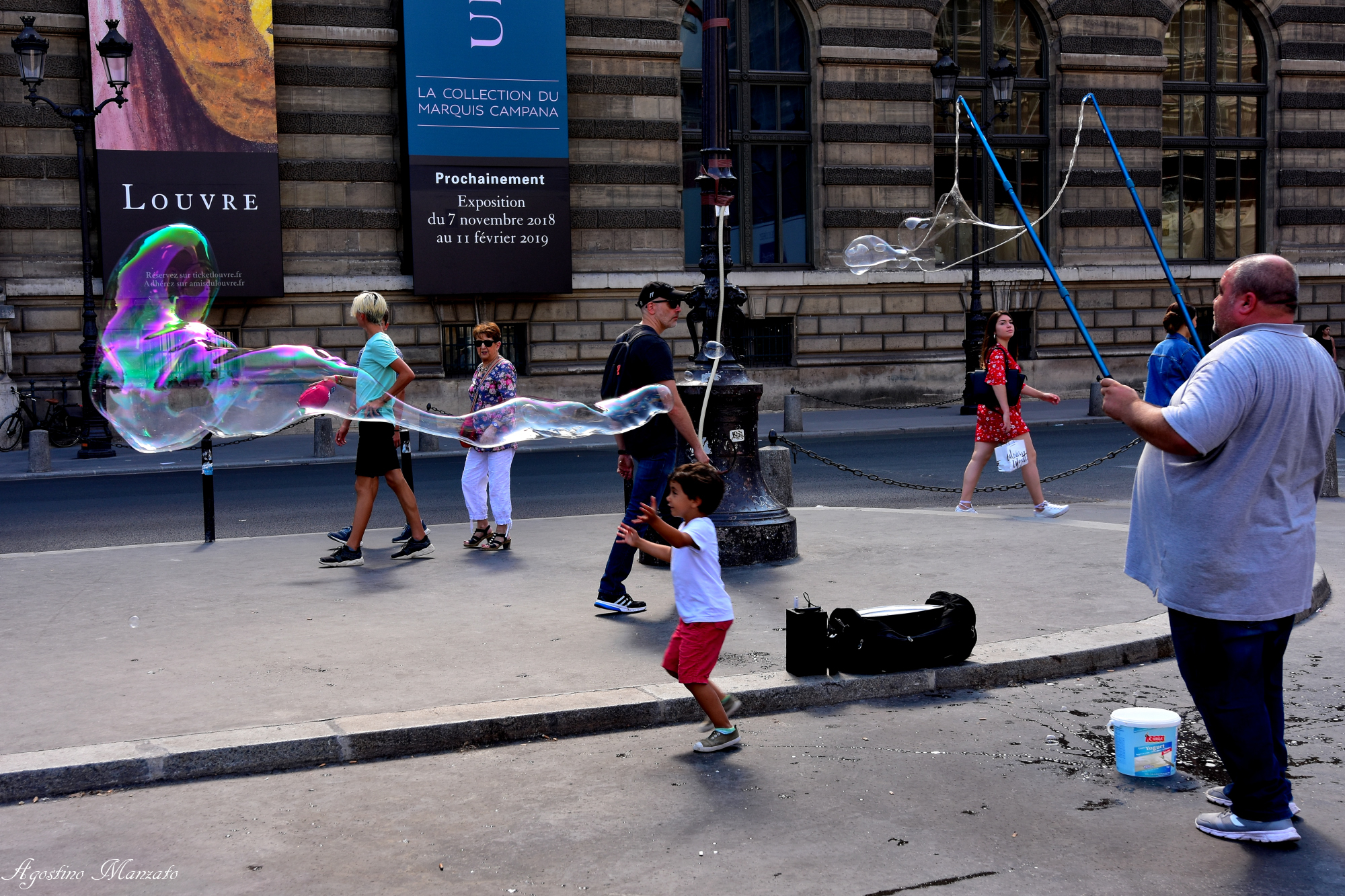 Playing in front of the Louvre