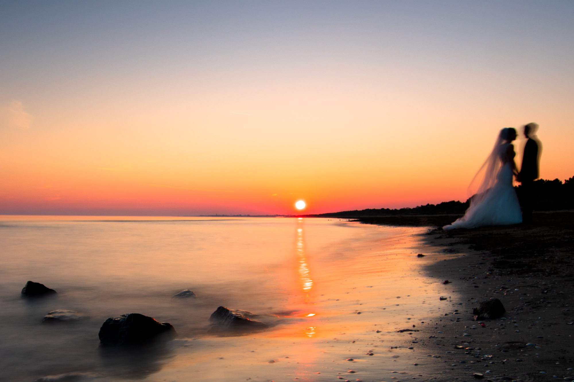 Bride and groom at sunset