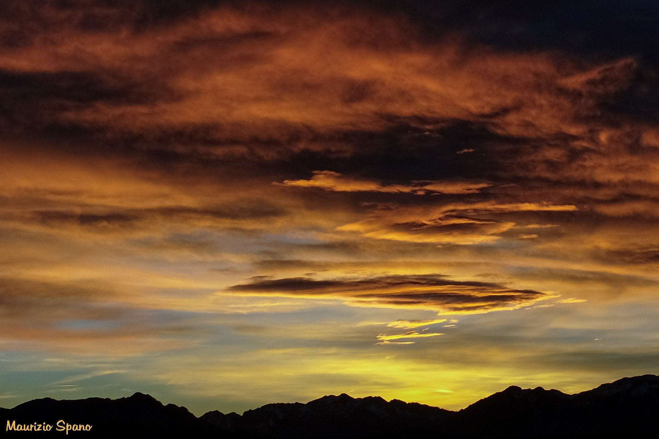 Almost touching the color of the clouds...