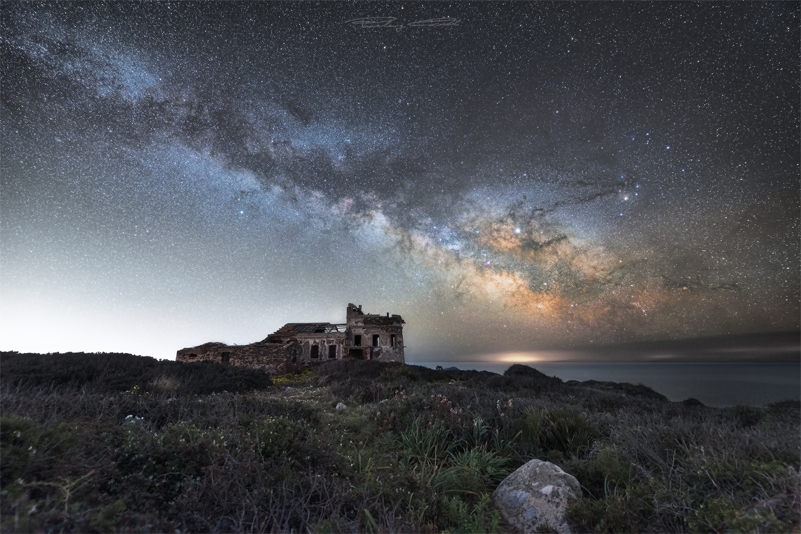 A traffic light under the stars