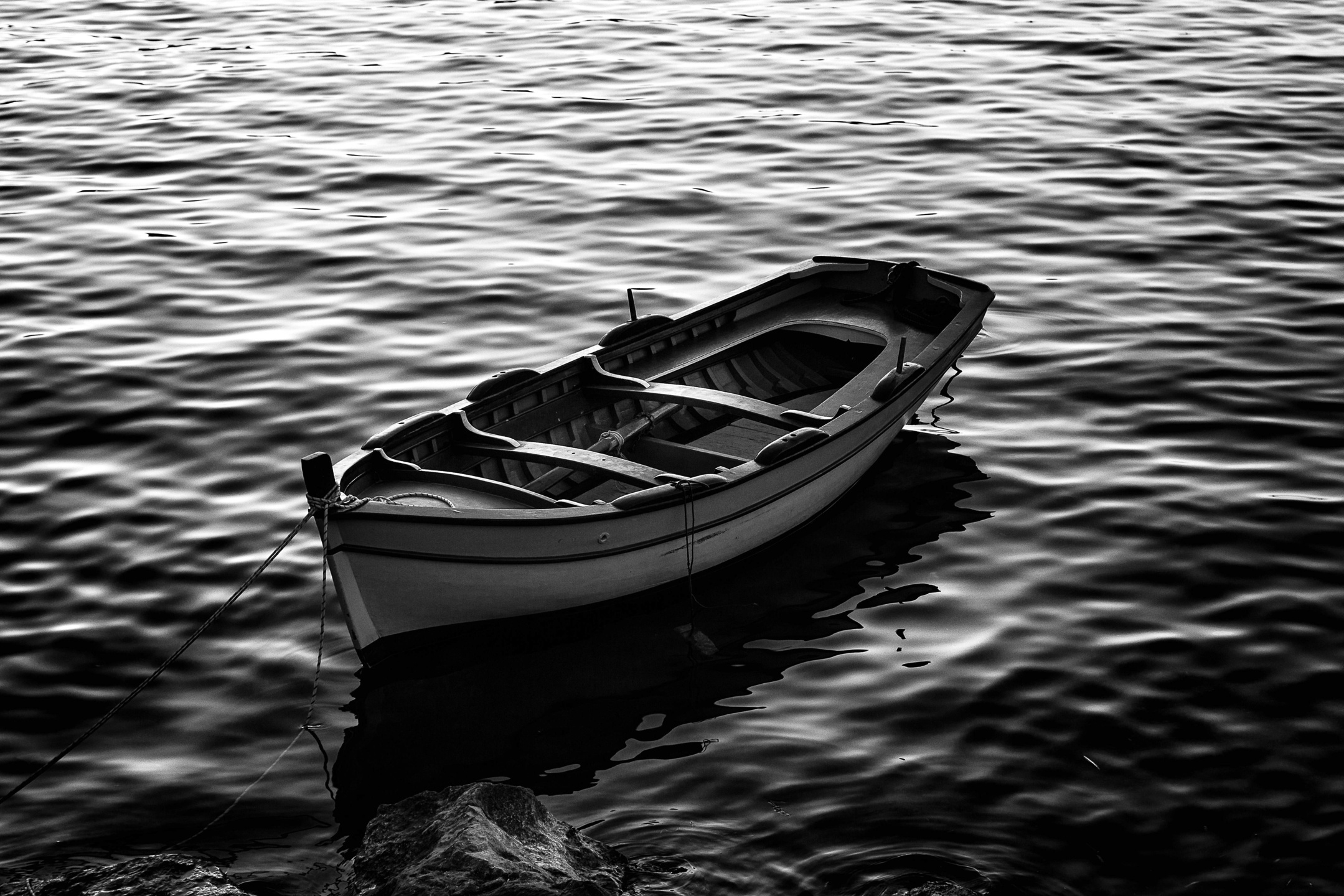 Near the shore, there's an empty boat.
