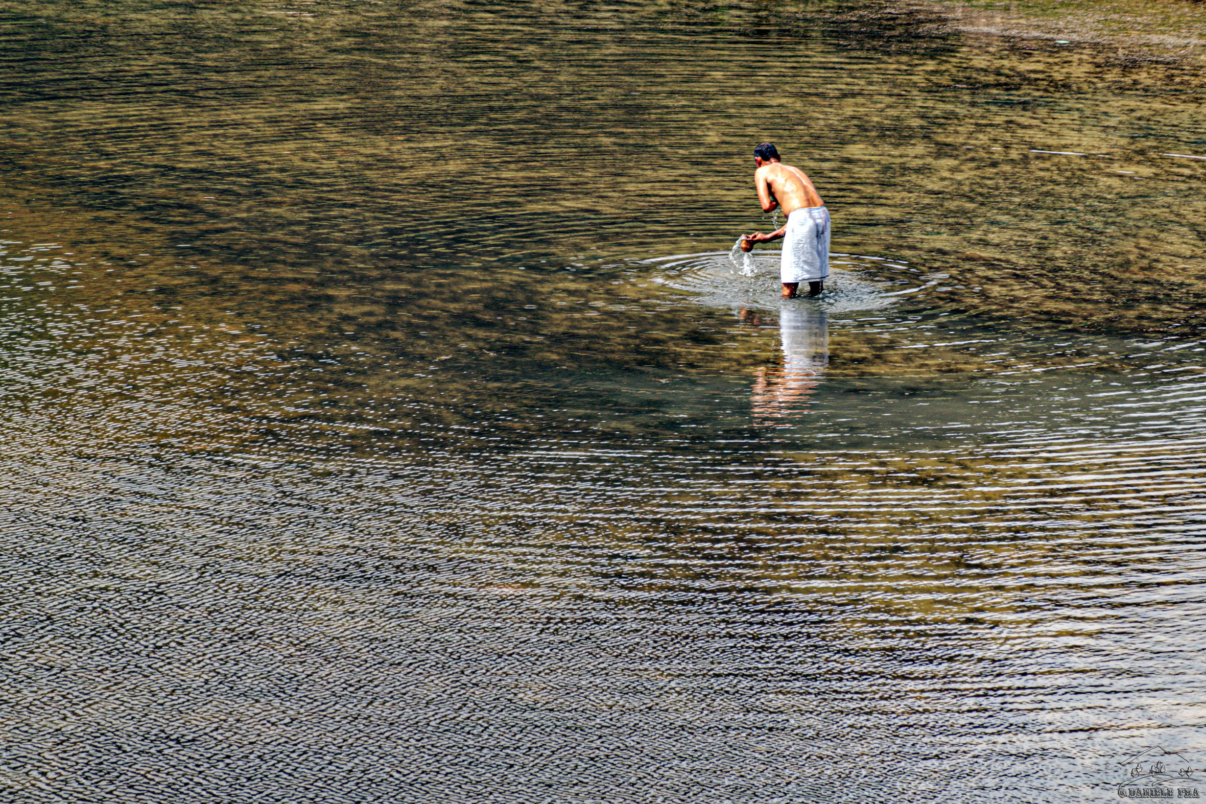 Hindu pilgrim at the sacred lake of Damodar Kunda