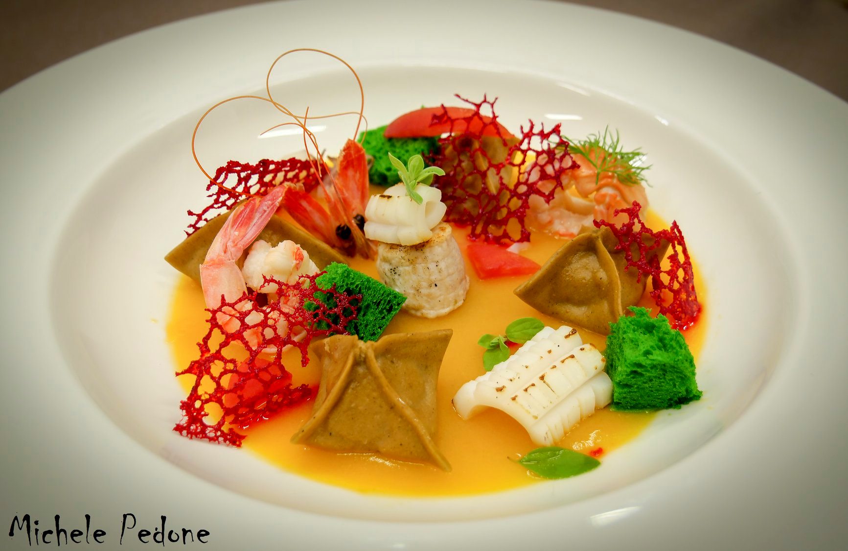 Raviolo di grano arso ripieno di zuppetta di mare......