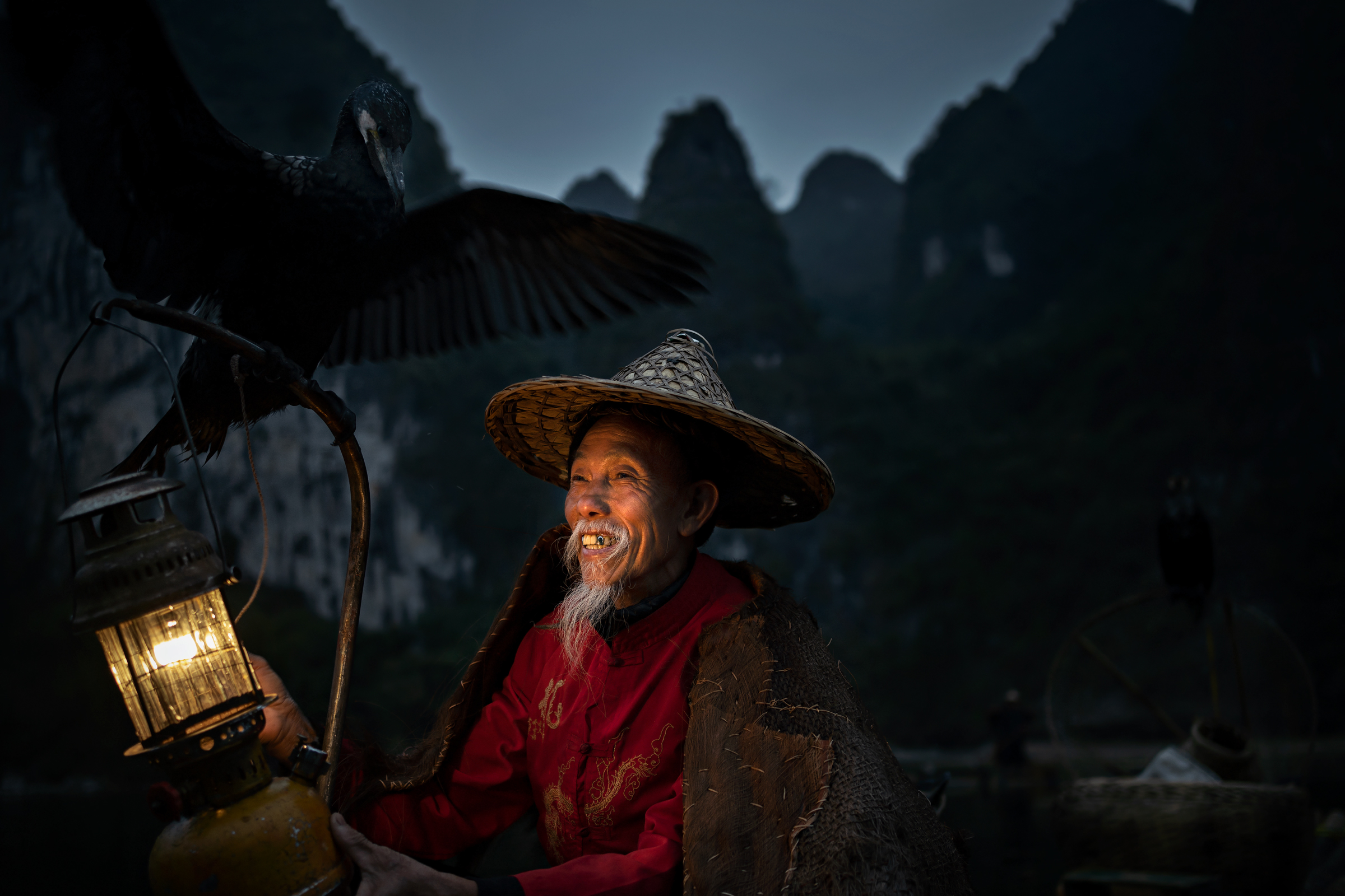 China 2020. Fisherman with cormorant