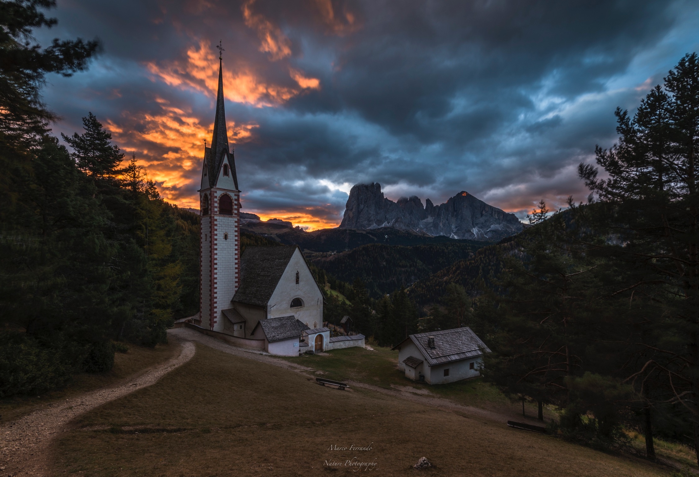 First lights on the church of St. James - Ortisei