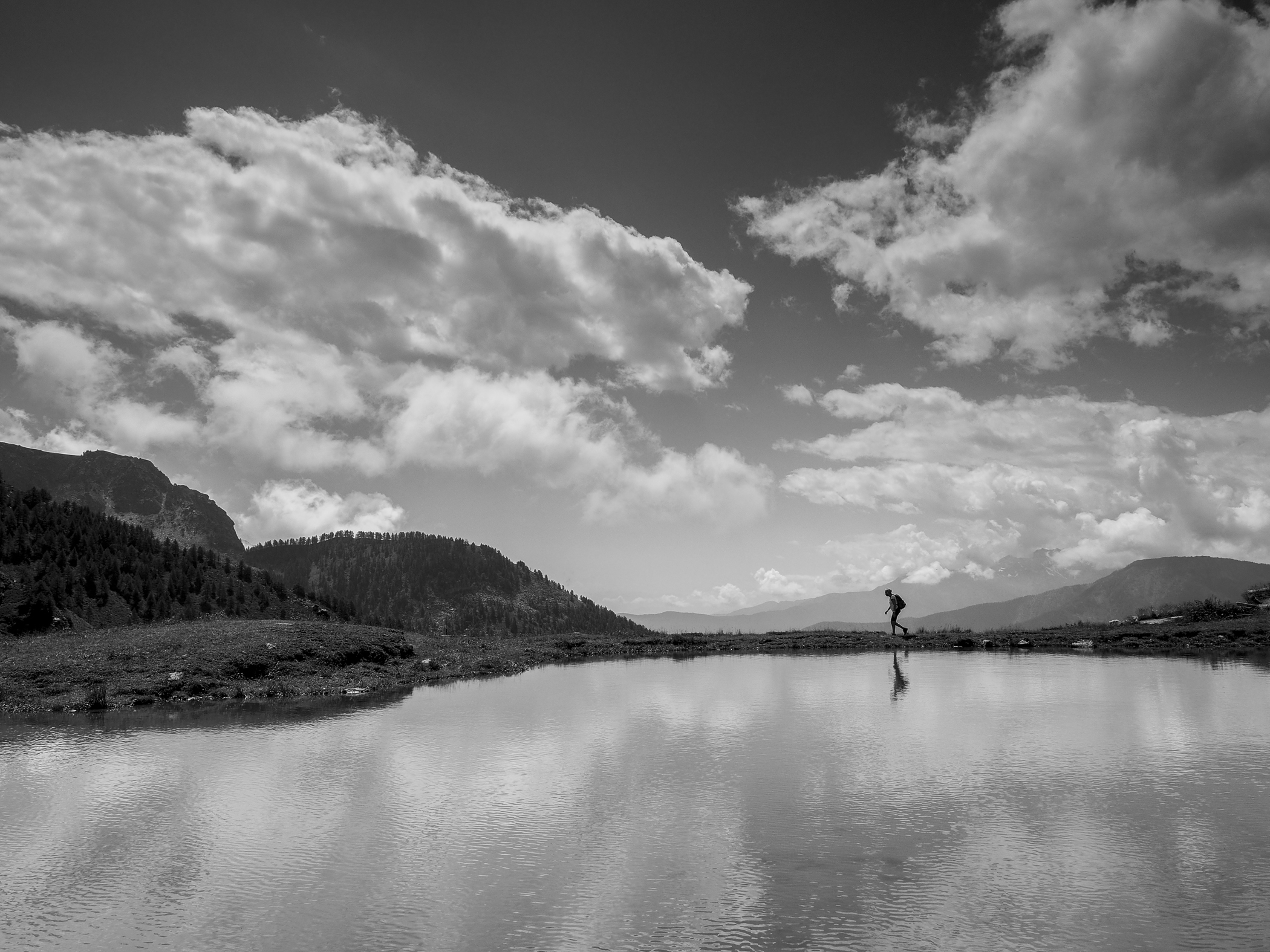 Man in water, earth and clouds