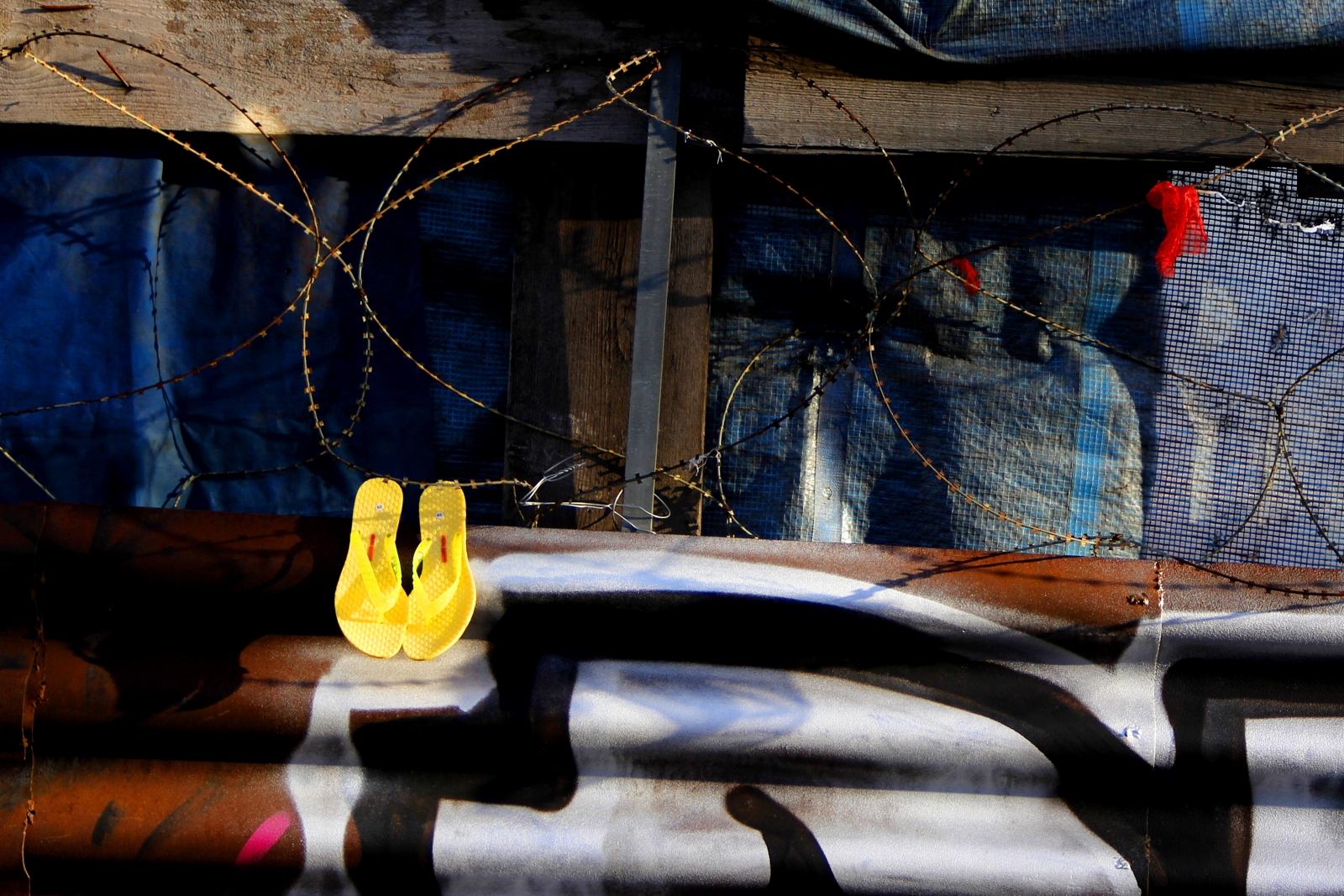 beside the barbed wire