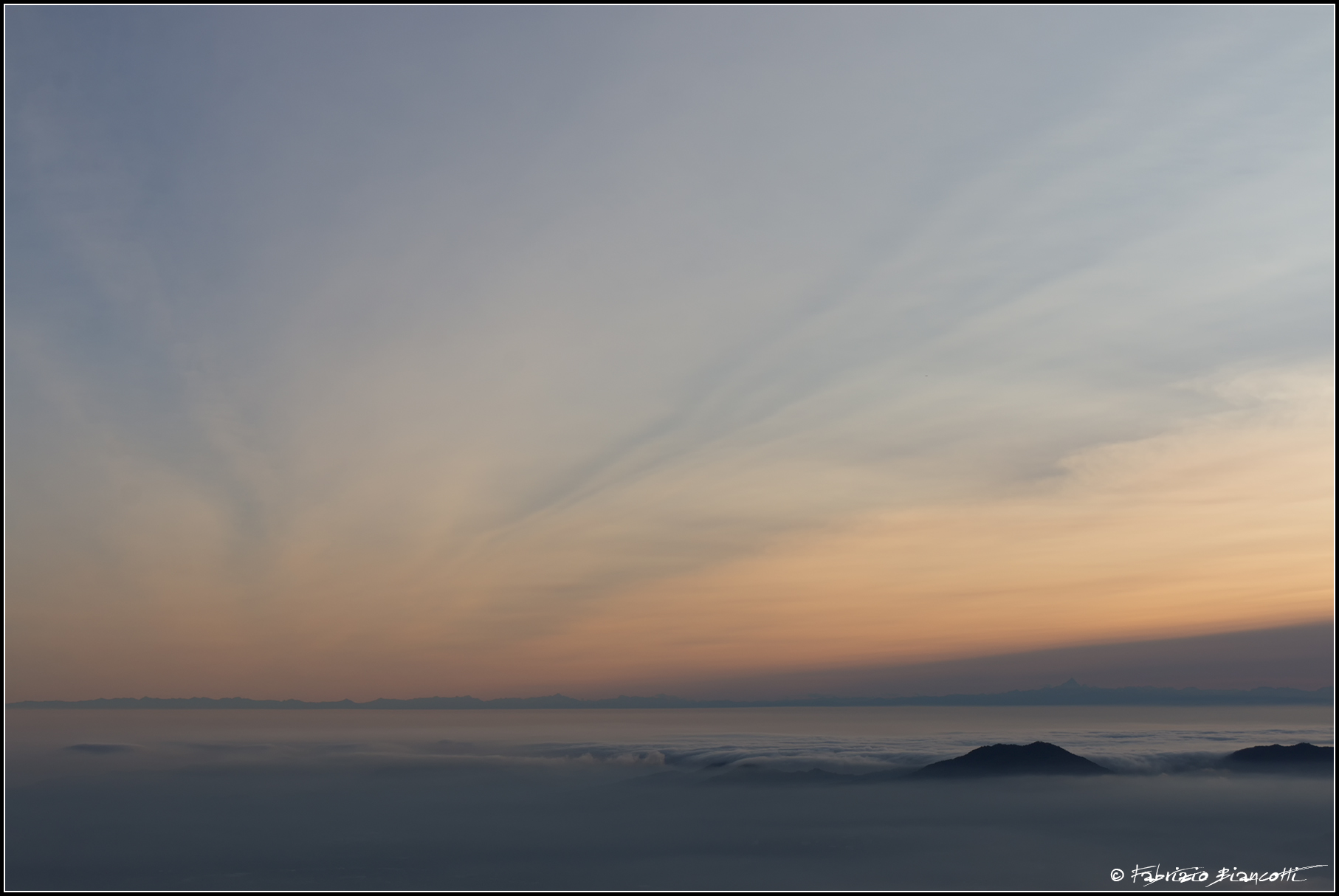 Sunset over a sea of clouds