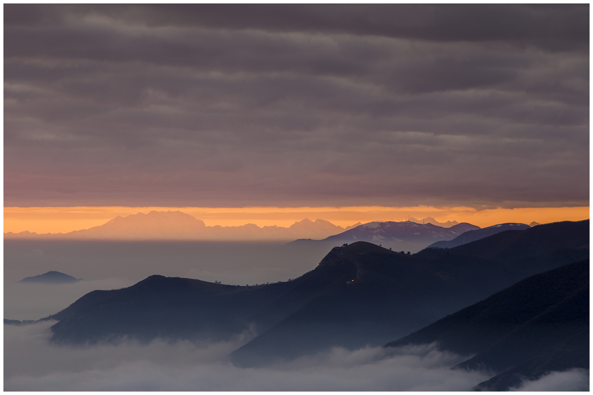 profiles of mountains at sunset