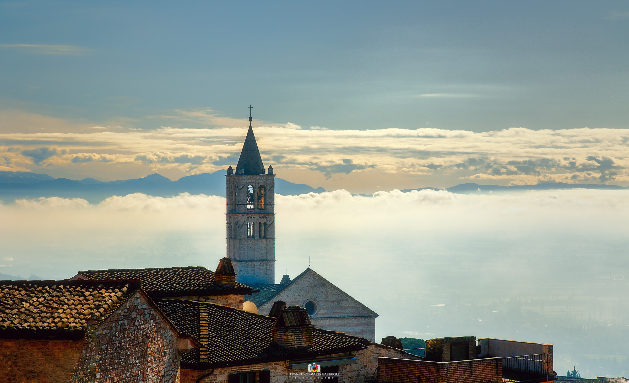 In the fog Assisi appears