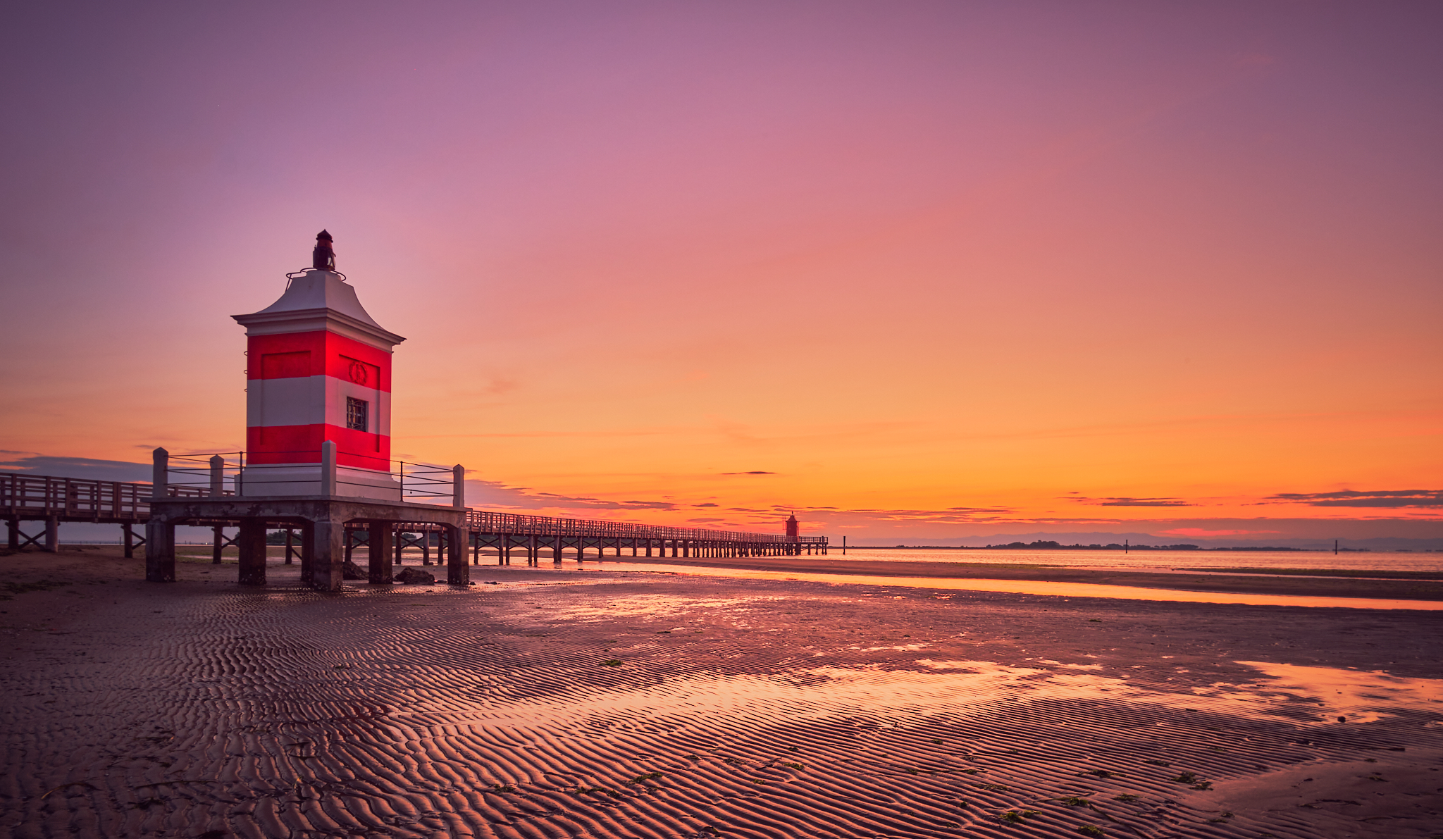 Sunrise at the lighthouse of Lignano Sabbiadoro