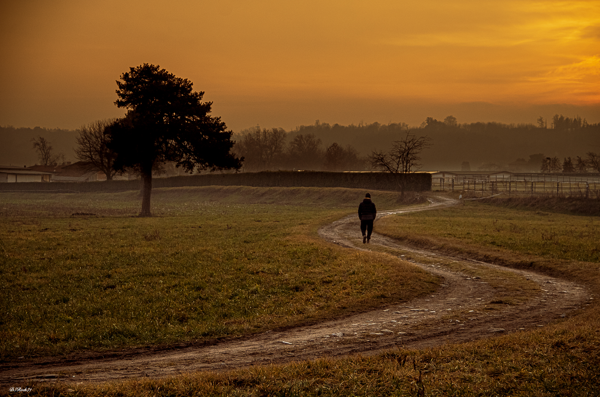 Lonely walker at sunset