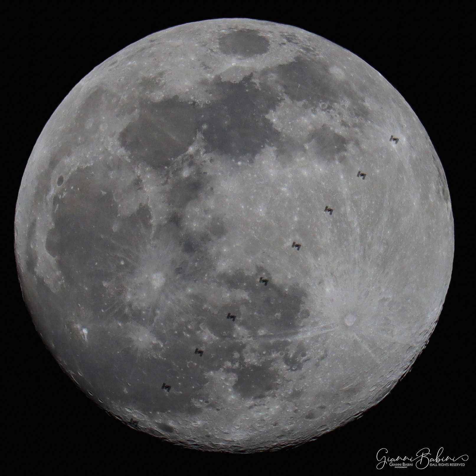 ISS in transit in front of the moon