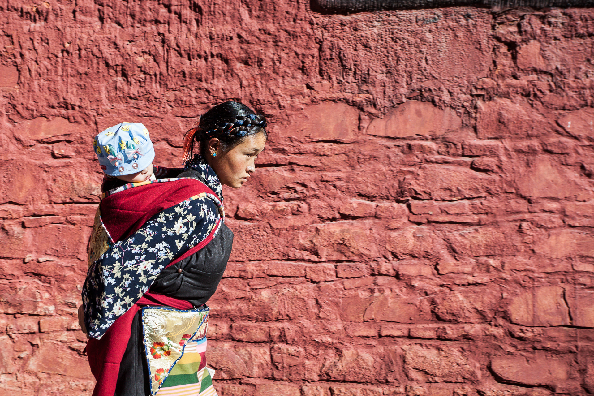 Shigatse, Tibet: young mother.