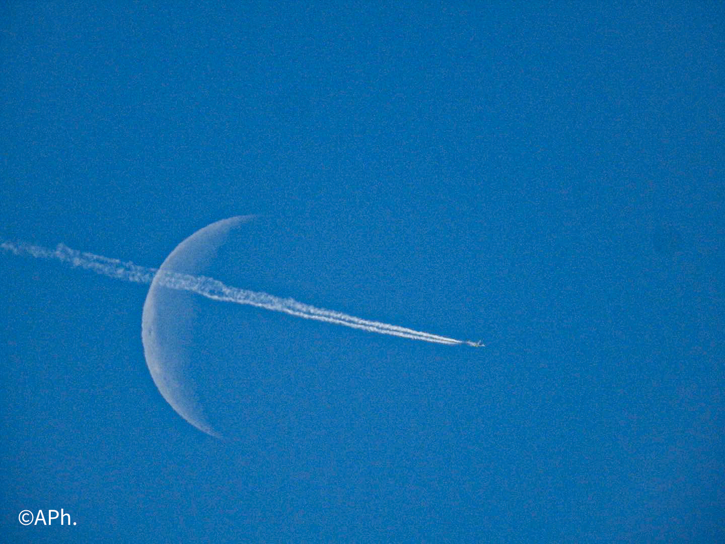 The SWITCH. Plane pierces the Moon