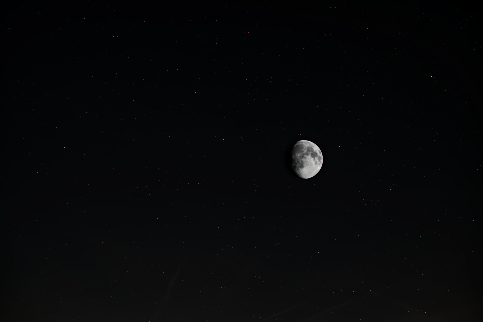 Black sky and distant moon