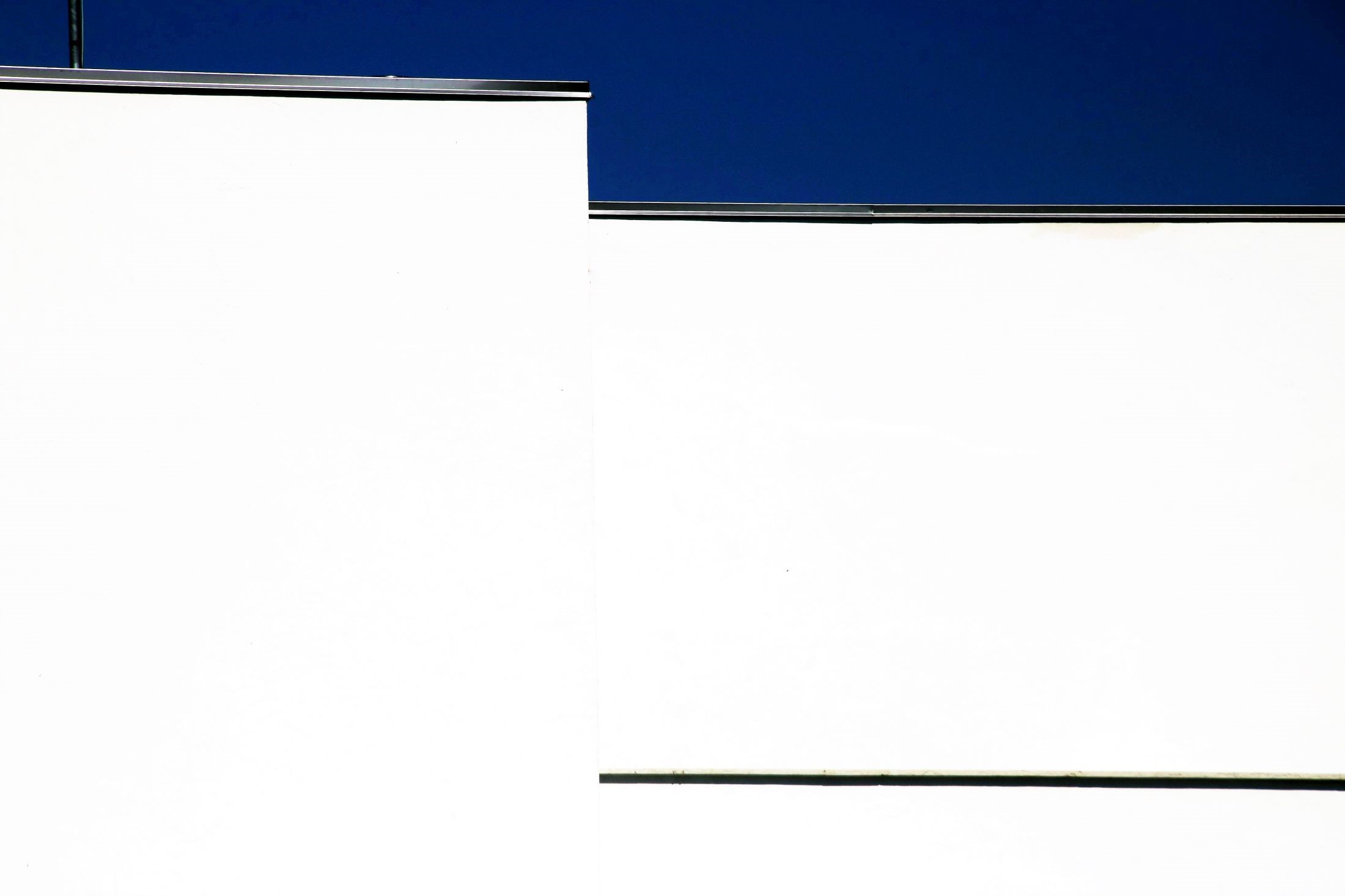 White walls under a blue sky