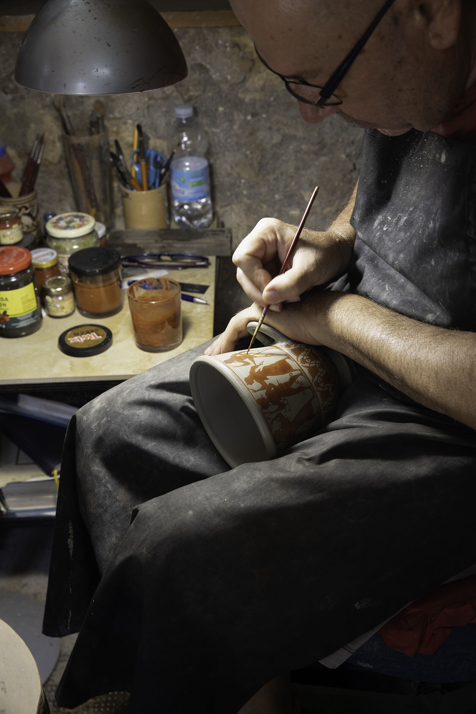 Craftsman painting an Etruscan vase