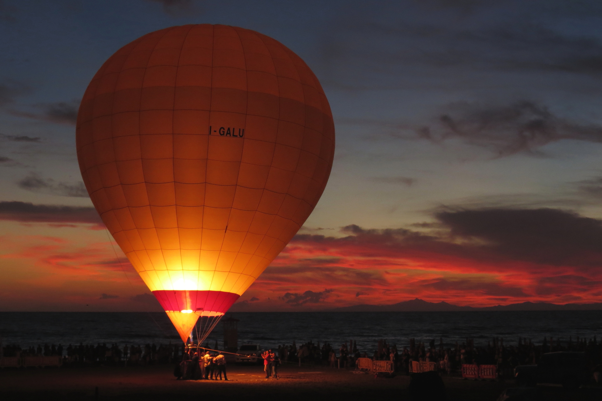 Hot air balloons on the beach at dusk