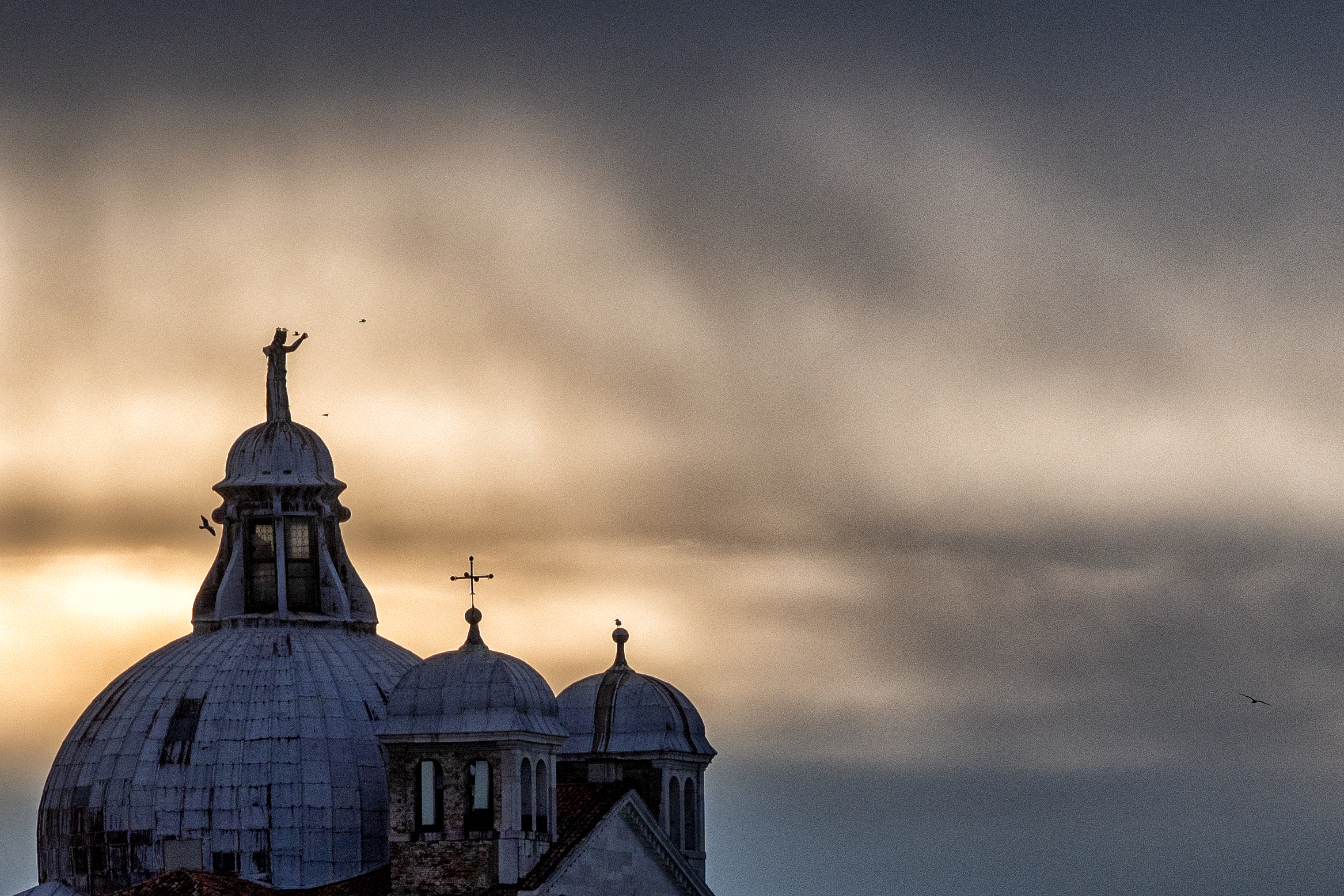Dark clouds and ... hope Dome of the Redeemer Venice