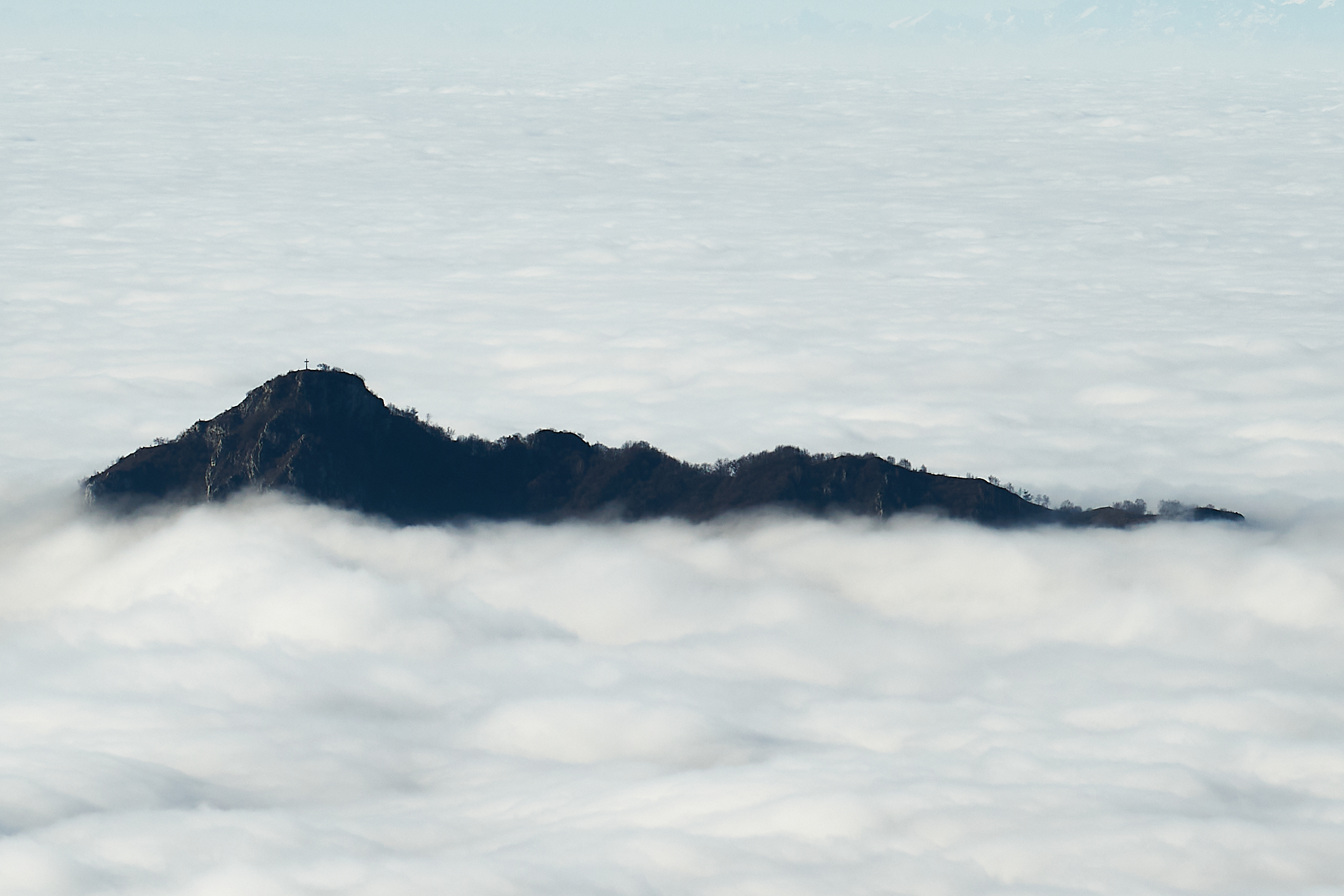 Monte Barro emerges from a sea of clouds